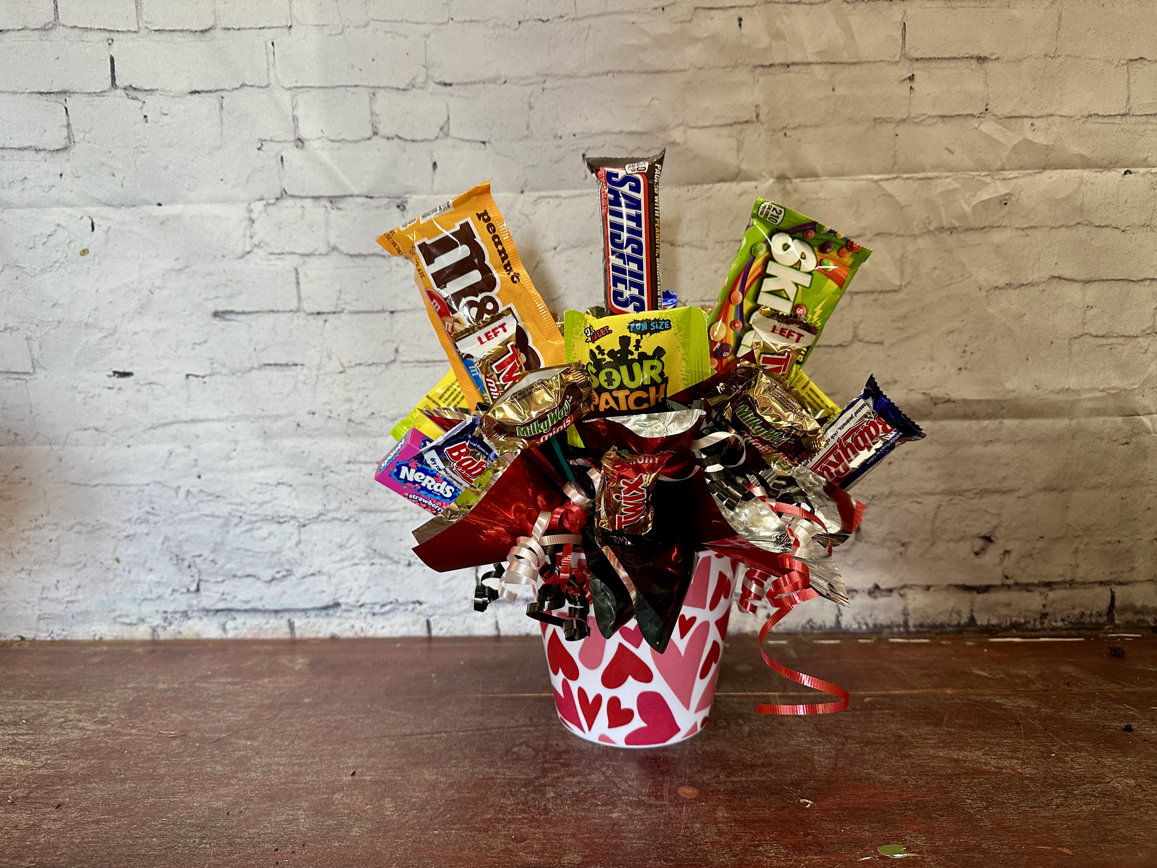 Cupid candy - Red and white heart container filled with an assortment of candy