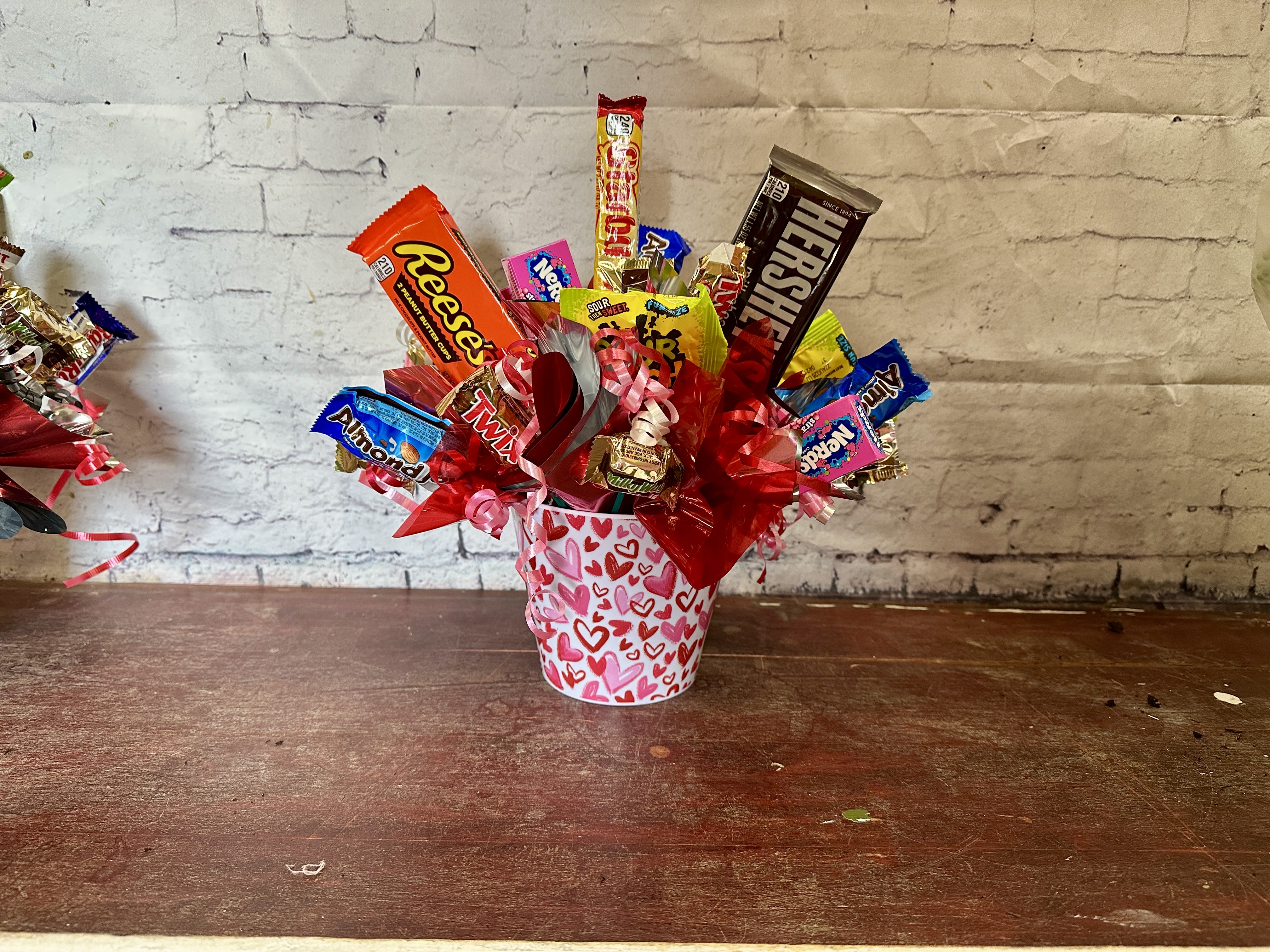 Smitten Candy  - Pink and red heart container with an assortment of candy 
