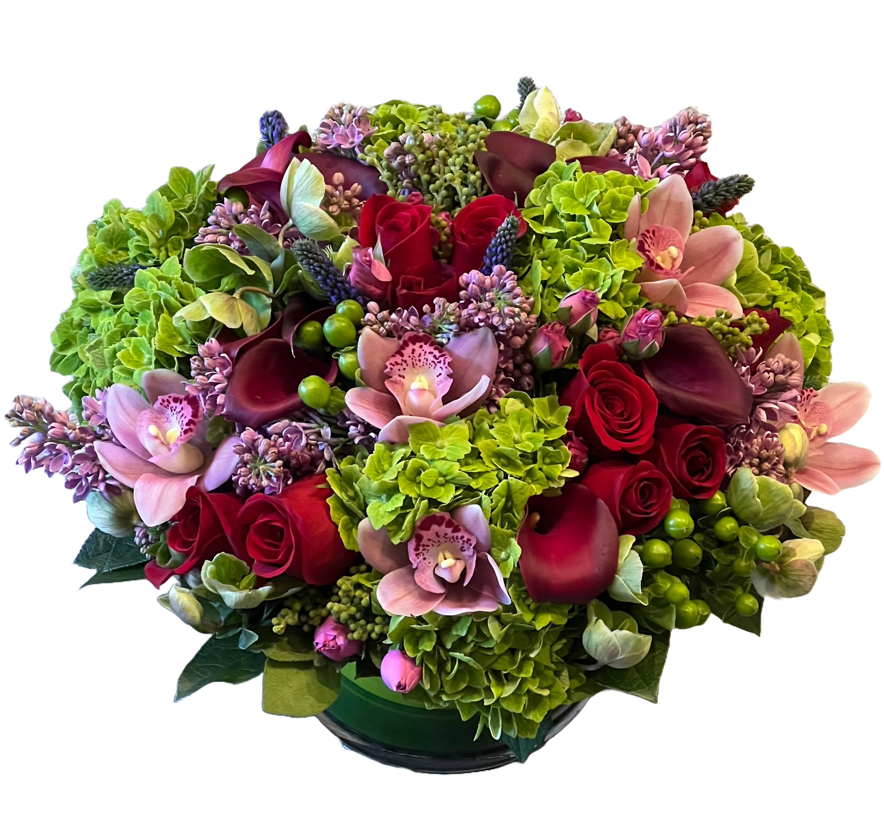 Drama - This romantic early spring arrangement features bold and passionate calla lilies, hot pink ranunculus, and veronica, accented with delicate hellebores and fragrant freesias. Wisps of greenery, such as eucalyptus, hydrangea or ivy, add freshness, while hints of soft lilac evoke the season’s renewal. Arranged in a tight European style, this bouquet feels effortlessly elegant—perfect for celebrating love and the first signs of spring.