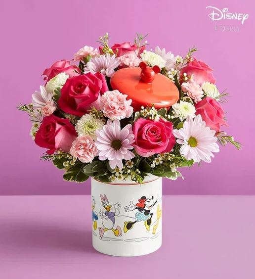 Disney Mickey Mouse &amp; Friends Cookie Jar - Beautiful - Share love this Mother’s Day with a gift full of character(s)! Part of our exclusive Disney collection, this handcrafted bouquet is gathered in a delightful mix of colors and designed in our whimsical Mickey Mouse and Friends cookie jar, featuring iconic animations of the whole gang. Great as a keepsake container or to keep delicious treats, it’s a sweet and nostalgic surprise for a special mom in your life.