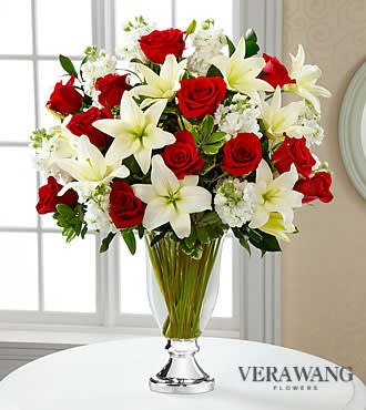 Grand Occasion Bouquet by Vera Wang - Grand Occasion Bouquet by Vera Wang is the perfect way to add sophistication and elegance into any celebration. Rich red roses collide with white stock and brilliant white Asiatic Lilies, accented with lush greens. Arranged in a clear glass vase with a gleaming metallic silver pedestal, this bouquet turns an ordinary day into an occasion of its own. GOOD bouquet is approximately 24inH x 21inW. BETTER bouquet is approximately 25inH x 21inW. BEST bouquet is approximately 26inH x 22inW. Lilies may arrive in various stages of development. The lily blooms will continue to open, extending arrangement life - and your recipient's enjoyment.