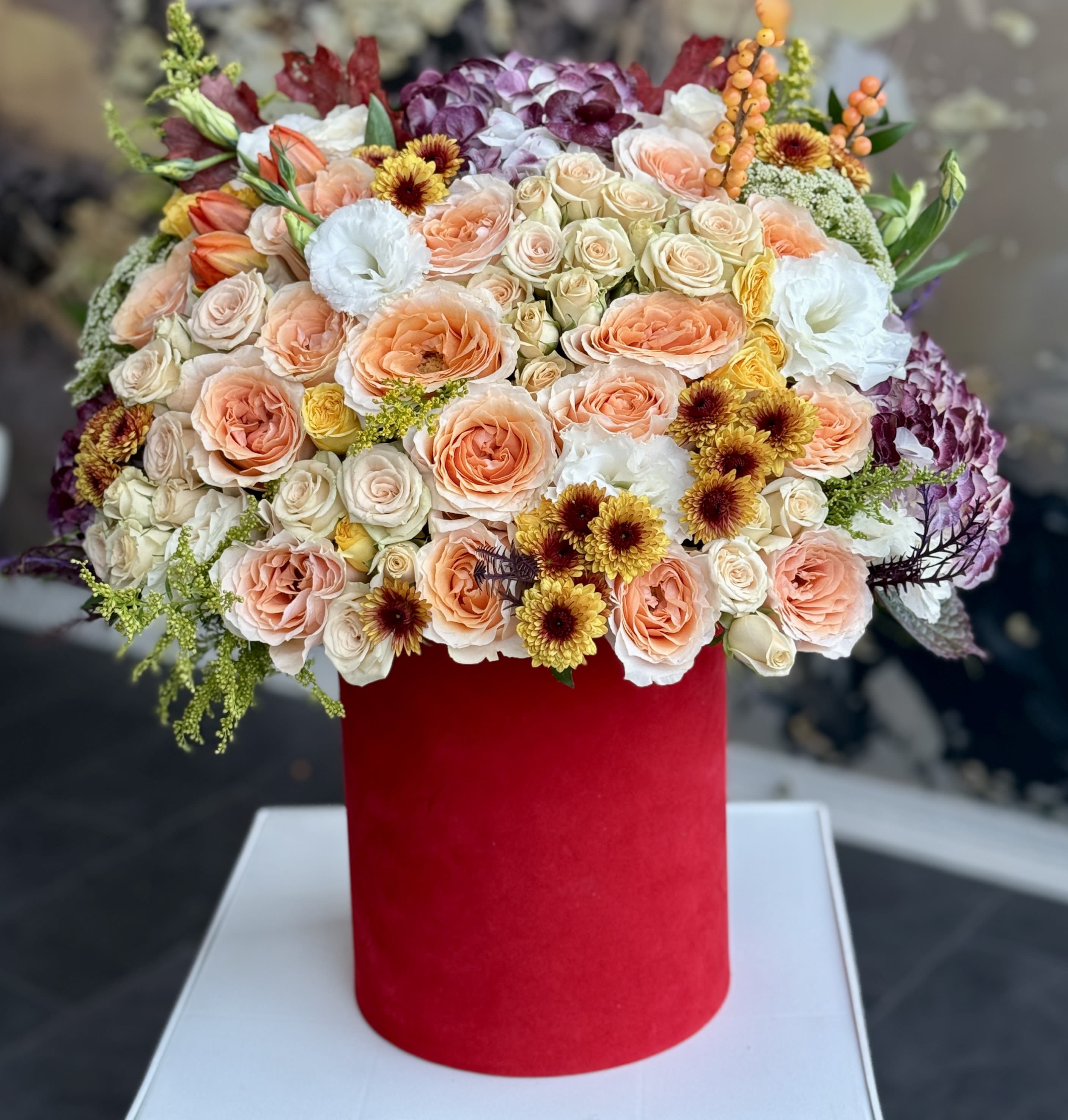 Terra harvest  - Brighten any space with our Elegant Flower Box Arrangement! Bursting with vibrant blooms, this stunning display combines seasonal favorites with lush greenery.  Housed in a chic, reusable container, it makes a perfect centerpiece for any occasion be it a gift or a treat for yourself. Elevate your decor with this captivating arrangement that brings joy and sophistication to your home or office.   Order yours today and let the beauty of flowers inspire you