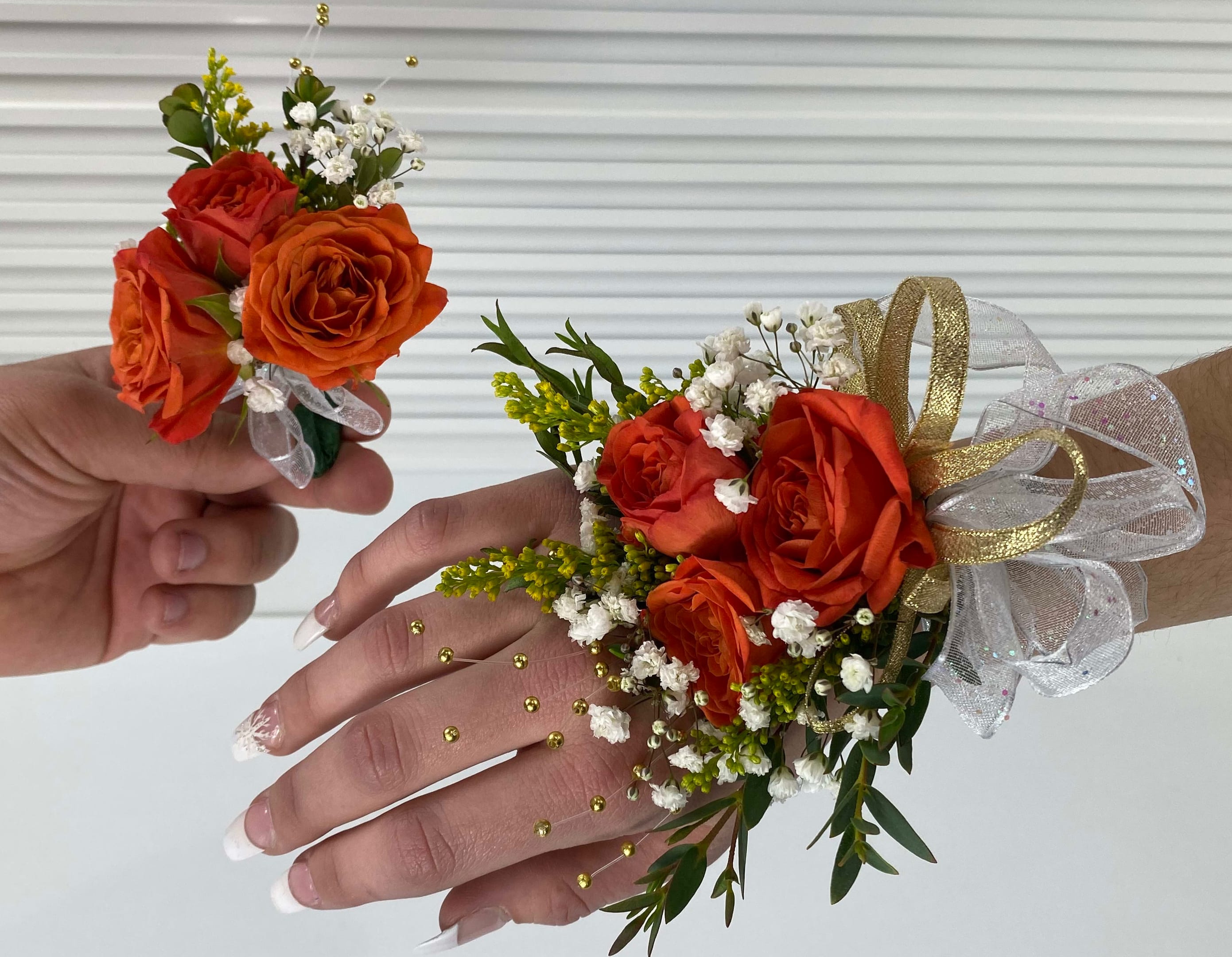 Corsages and Boutonnieres for High School Formals - Orange - Orange roses, embellishments, with white and gold ribbon.  