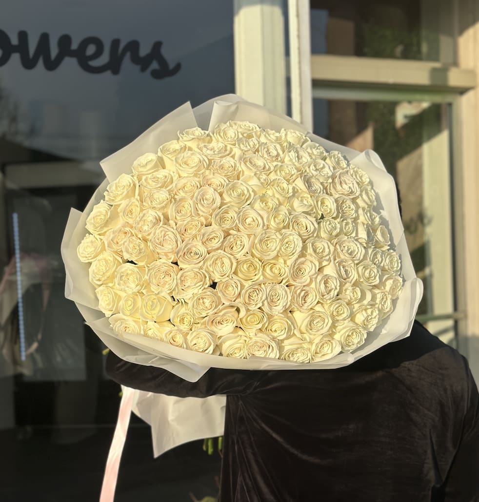 Angelic  - Brighten any space with our Elegant Flower Bouquet! Bursting with vibrant blooms, this stunning arrangement features seasonal favorites paired with lush greenery for a breathtaking display.  Perfect for any occasion, it makes an ideal gift or a special treat for yourself. Elevate your decor with this captivating bouquet that brings joy and sophistication to your home or office.  Order yours today and let the beauty of flowers inspire you!