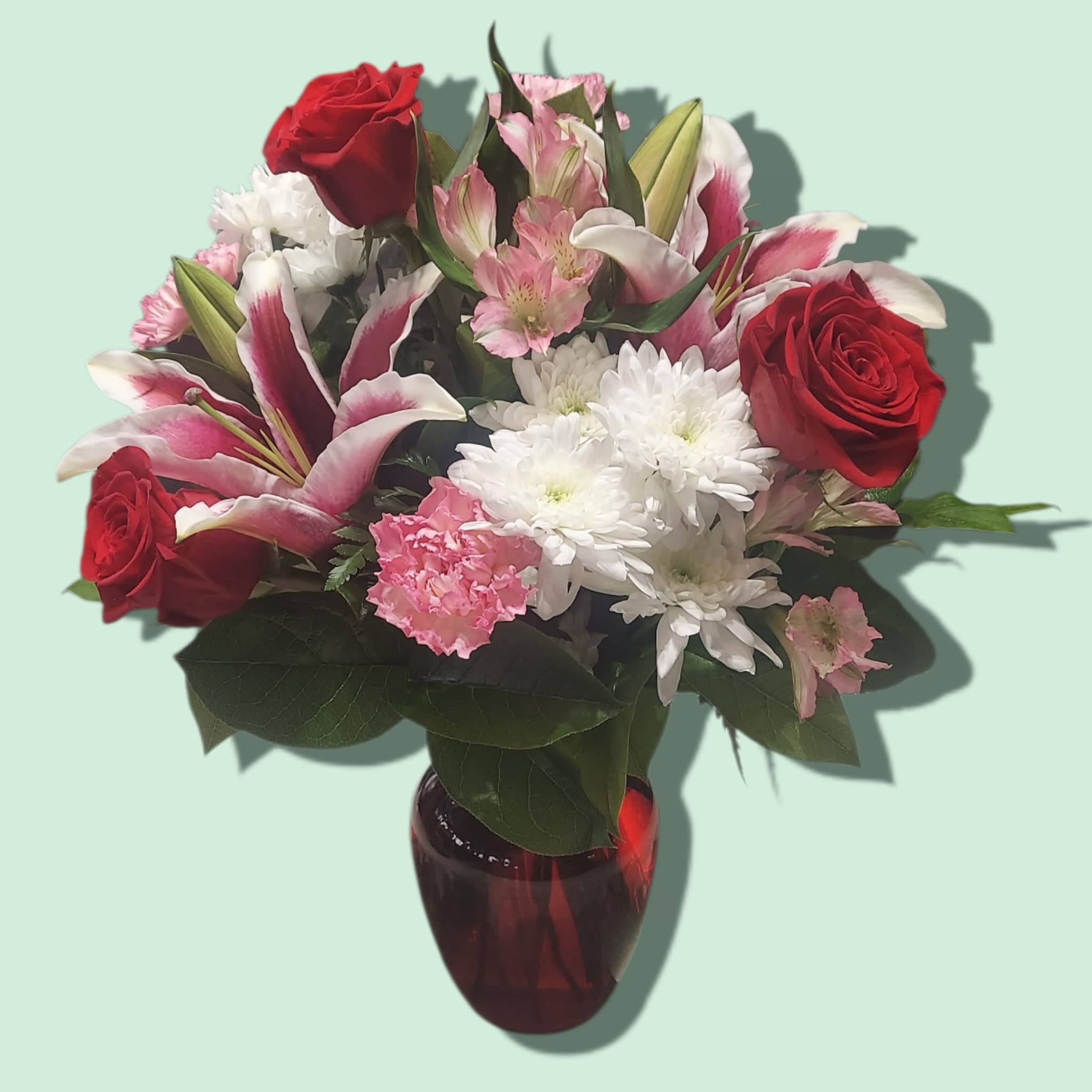 Forever &amp; Ever BQ - There's no better way to tell your special one that you love them then sending them our Forever &amp; Ever bouquet! A vibrant mix of lilies, roses, carnations, chrysanthemums, and alstroemeria lilies are featured in a red vase.  APPROXIMATE SIZE: 21" H x 20"W