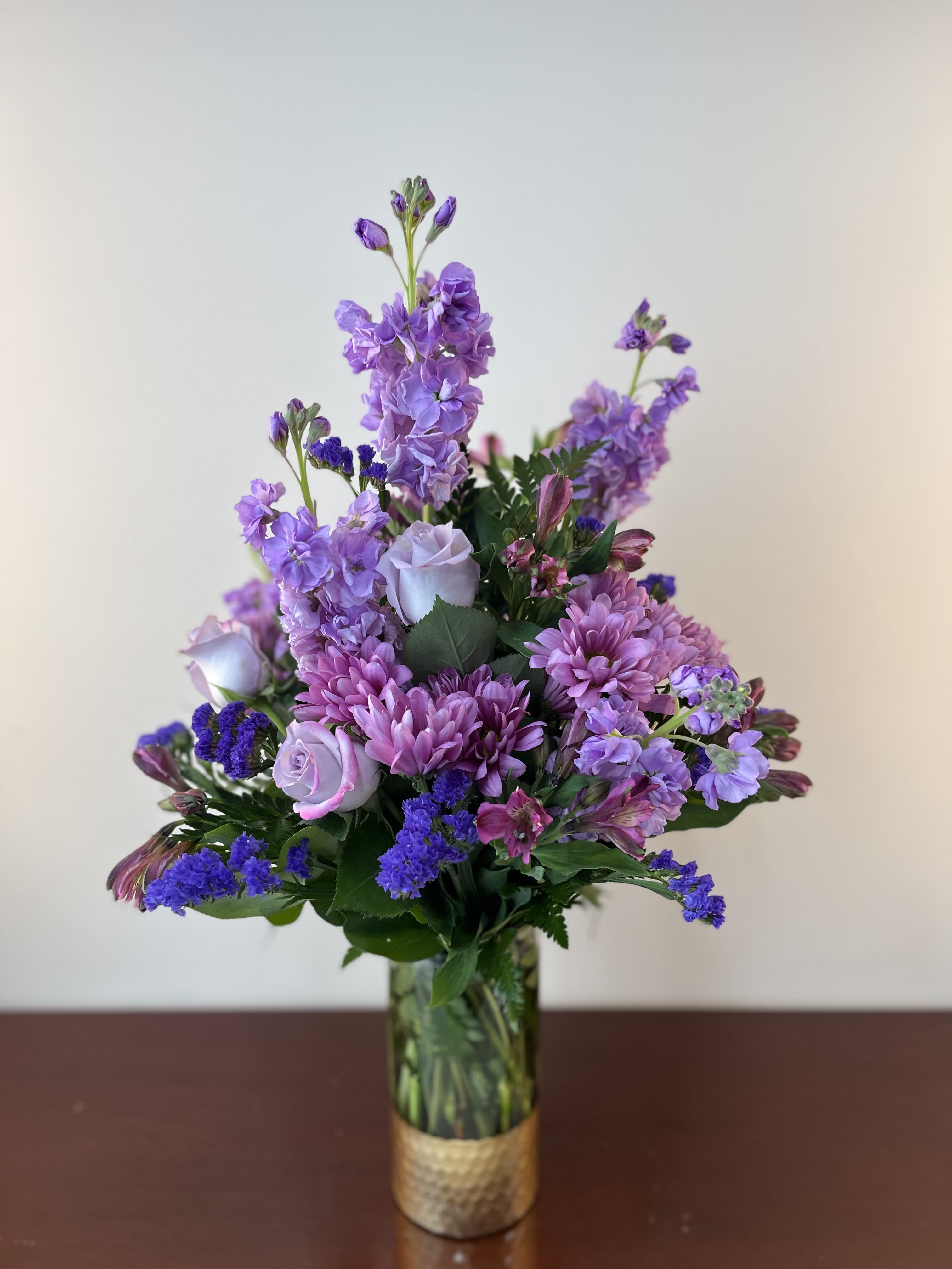 PURPLE PASSION - DO YOU HAVE SOMEONE CRAZY FOR PURPLE IN YOUR LIFE? IF SO, THIS STUNNING ARRANGEMENT HAS PRESENCE AND FITS THE BILL!  SURE TO PLEASE WITH ITS TONES OF LAVENDER AND PURPLE!