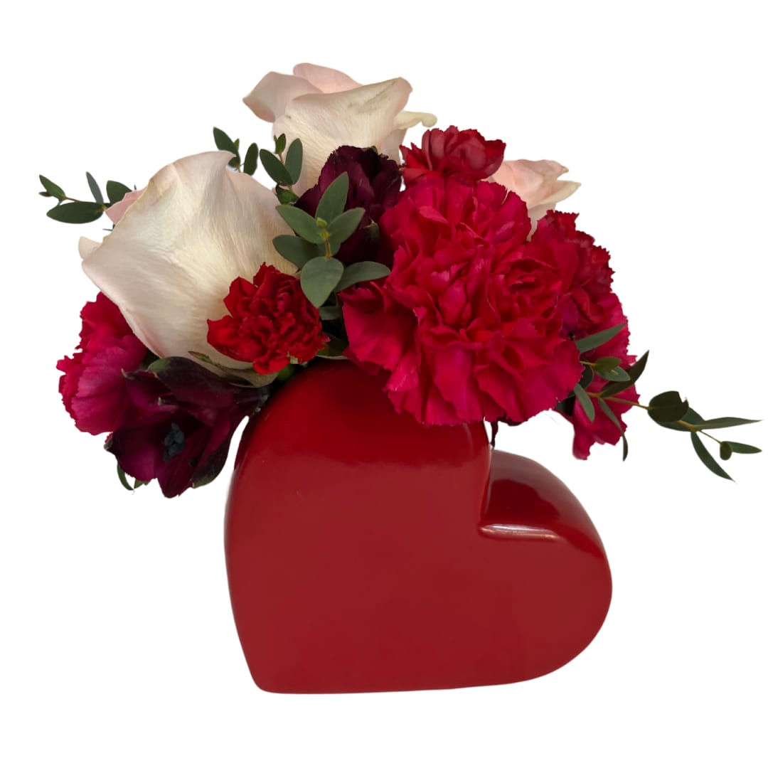 Sweet Heart - Red - Express your love and appreciation with this charming flower arrangement, delicately arranged in a heart-shaped vase. These blooms—featuring a mix of roses, carnations, and alstroemeria—bring a touch of sweetness and elegance to any space. Perfect for anniversaries, Valentine's Day, or simply to brighten someone's day, this thoughtful gift is sure to capture hearts and add warmth to any occasion.