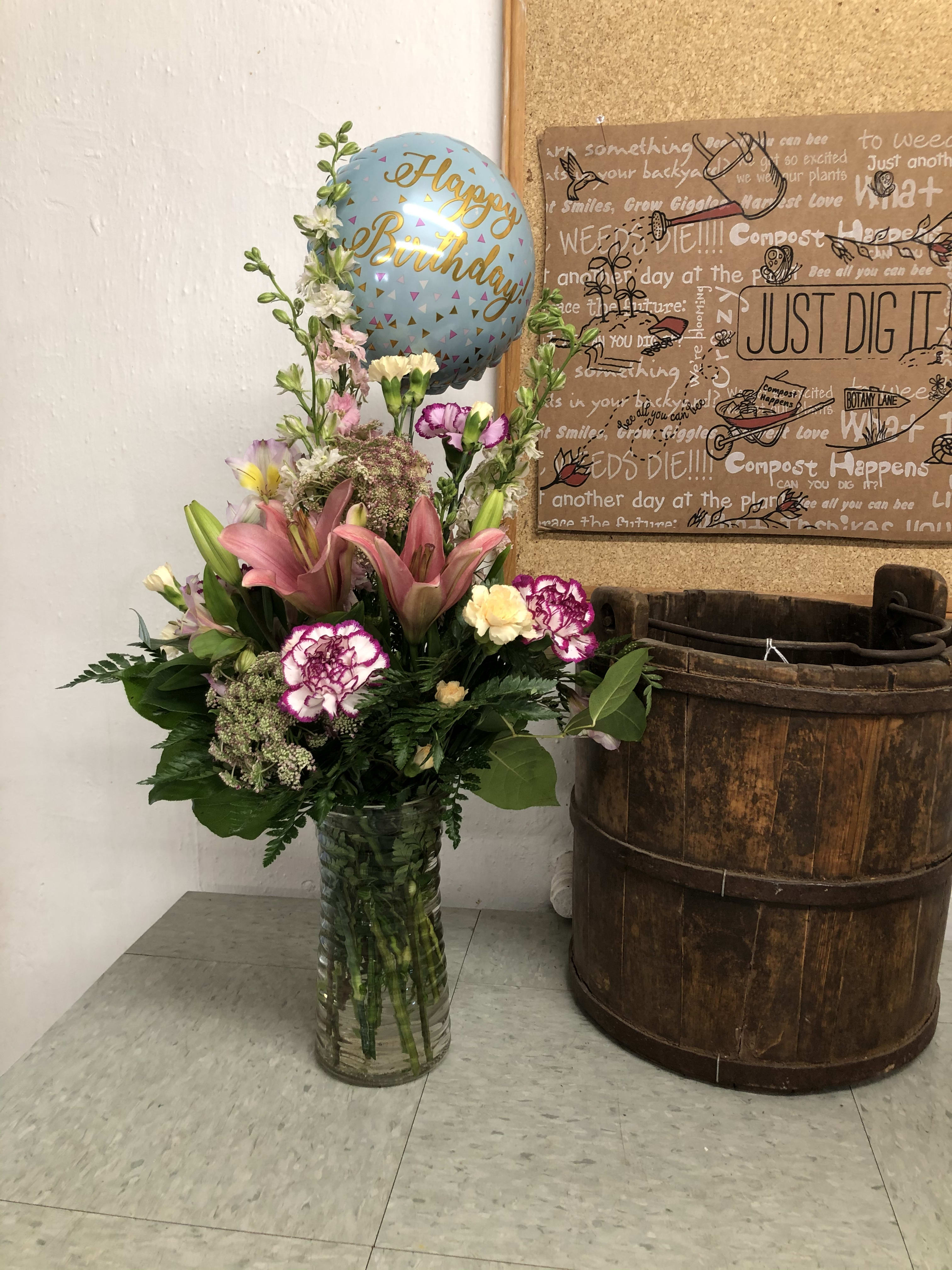 Birthday Party  - Birthday arrangement in a clear glass vase with a 9 inch air filled birthday mylar balloon. Designers choice of flowers and colors. We will use only the freshest flowers to convey your special birthday surprise. 
