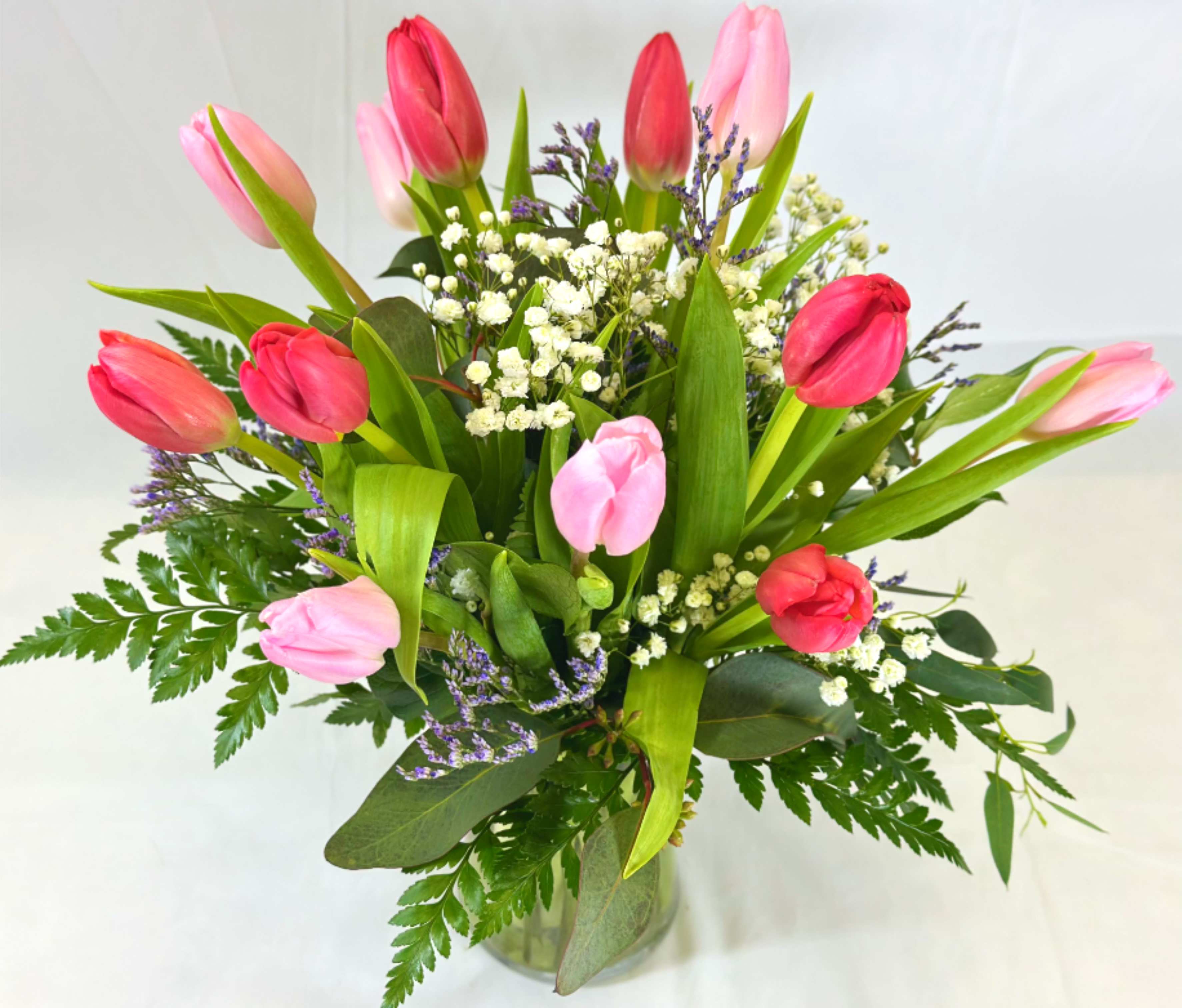 Tulip Love - There is nothing like tulips for the simple beauty of Spring! This Leary's Flowers exclusive arrangement shows off this wonderful flower in pink and red. It will be great for Mother's Day, Valentine's Day, Easter, or any time you want to show someone special that you care.  If the featured flowers are unavailable we will design your arrangement using the freshest available blooms of equal or greater value.