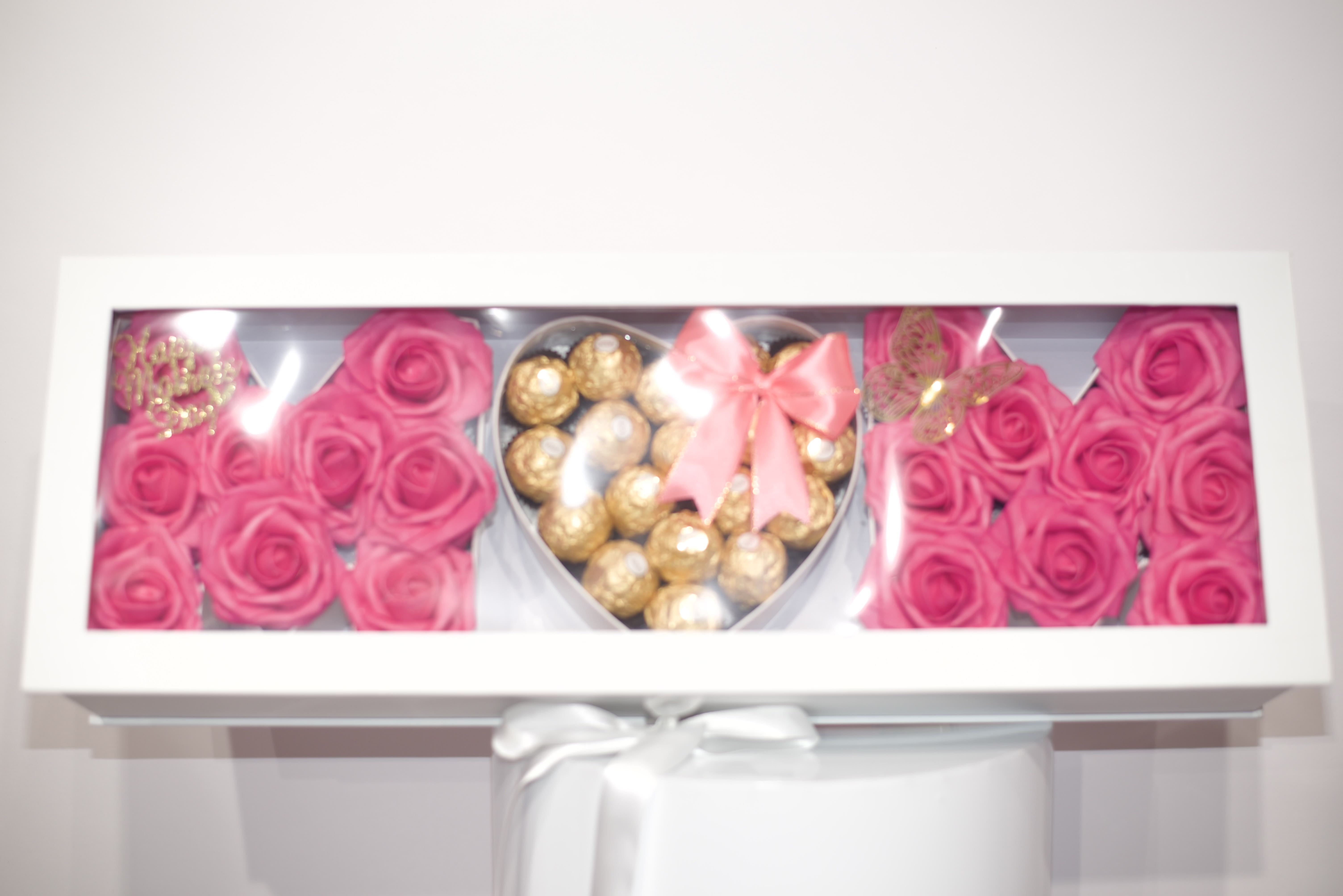 MDC mom white box arrangement  - Our luxury mom white box arrangement  Hot pink natural roses and Ferrero rocher chocolate, decorative with ribbons, crown and butterfly 