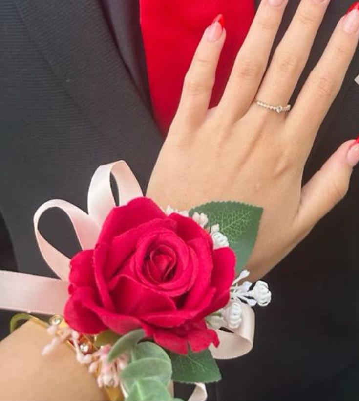 Red corsage - A classic red corsage that compliments any suit. A perfect addition for any prom, formal, or wedding event  boutonnière that compliments any suit.