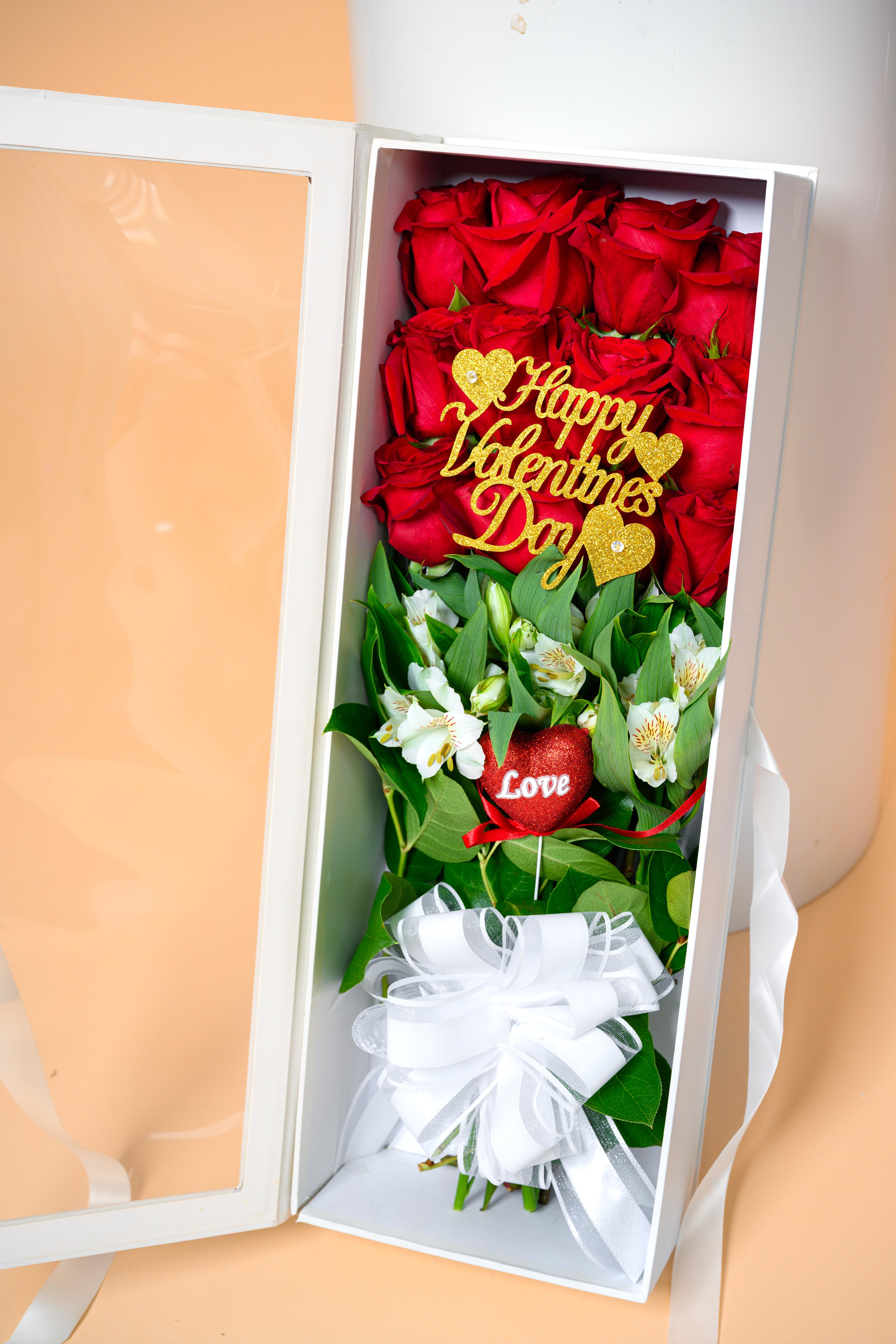 Pure Romance Luxe Box - A stunning composition of vibrant red roses and graceful white flowers, designed inside a modern luxury box for a clean, elevated presentation. With romantic Valentine accents and refined detailing, Pure Romance Luxe Box is perfect for celebrating love in its most beautiful form.