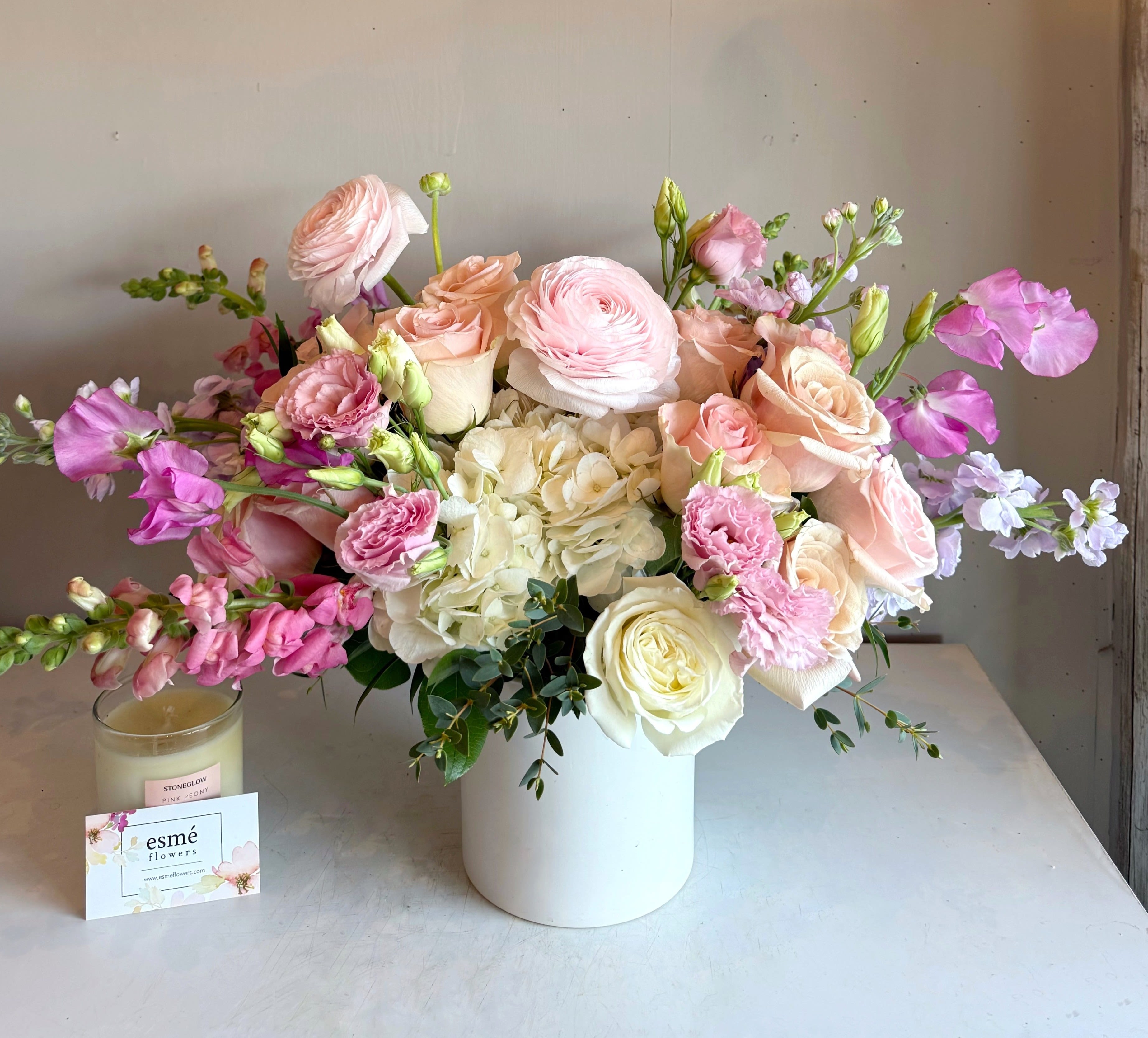 Amélie - Soft, romantic, and timeless. This arrangement blends blush pink and creamy white blooms for an effortlessly elegant expression of love.  
