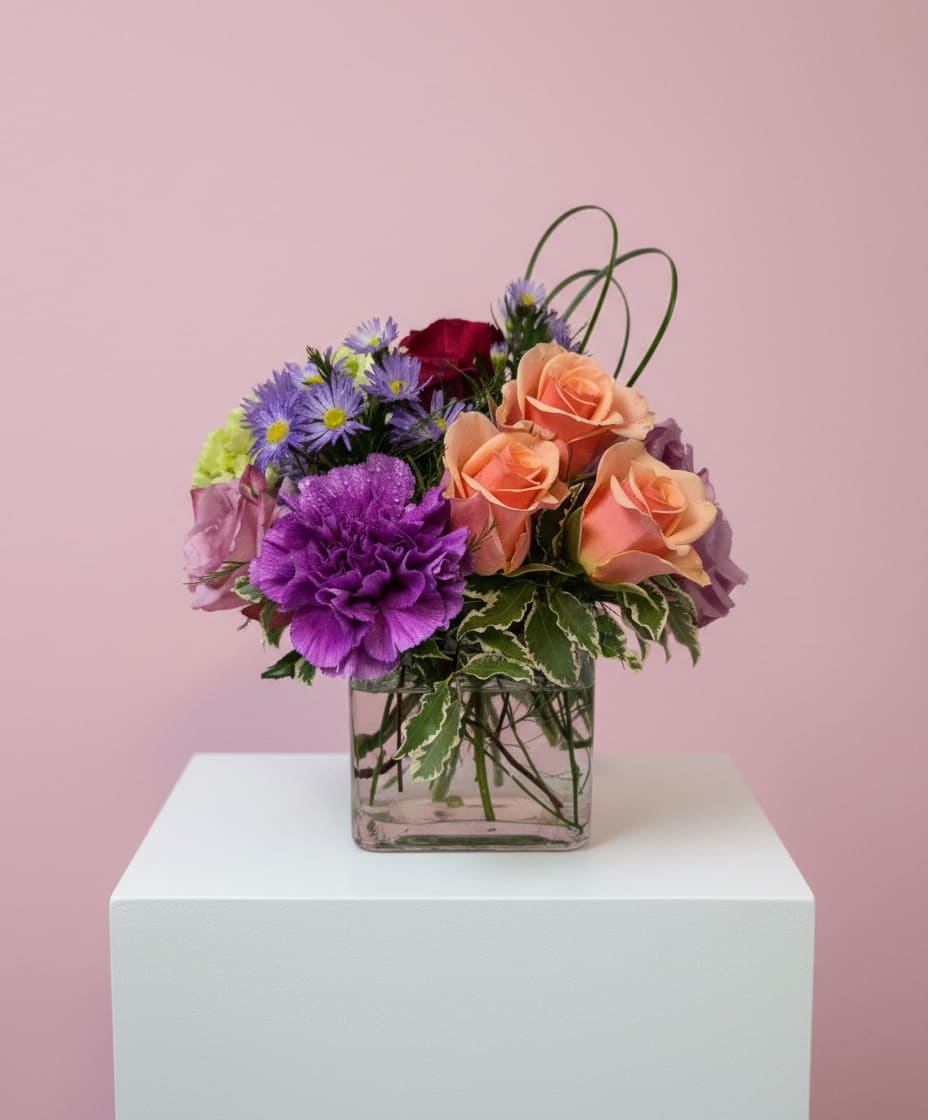 Foxy Fling Flowers - This arrangement includes roses, green hydrangea, seasonal flowers with beautiful filler. Spring Fling Vase is a great gift for a birthday, get well, or just because. PLEASE NOTE~ Seasonal flowers will be substituted if flowers shown are not available.  APPROXIMATE DIMENSIONS: 12" H X 12" W