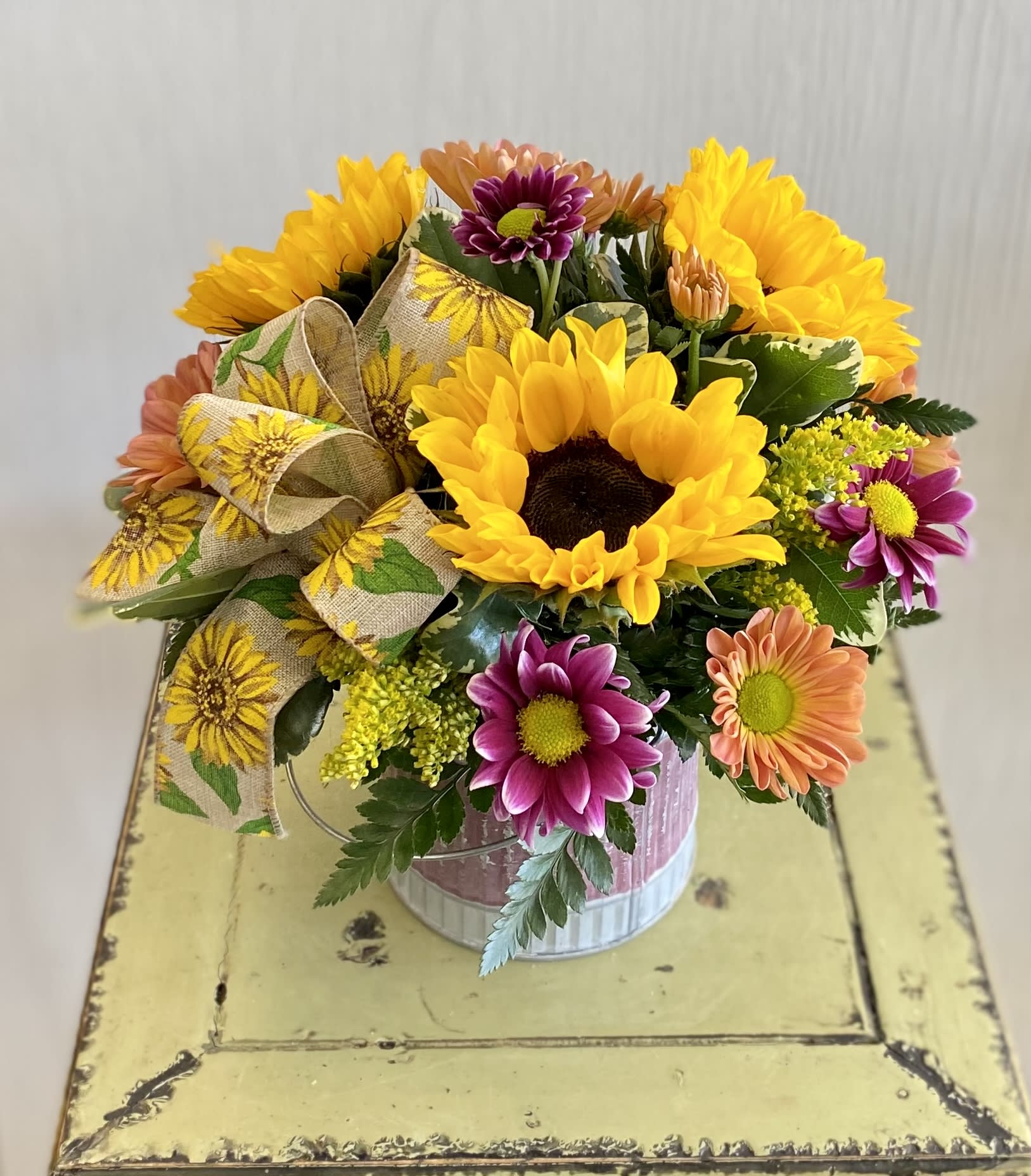 Garden View - Sunflowers are the star here! Container will vary.  