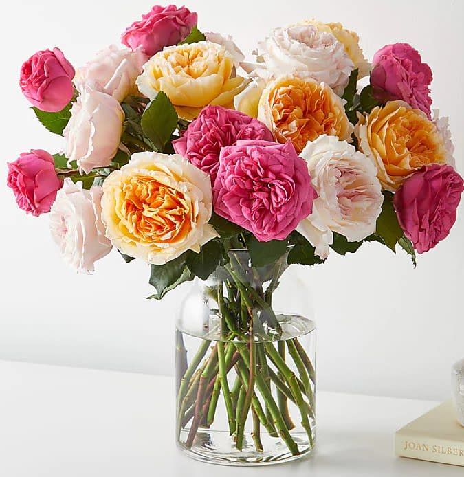 Carpe Diem Bouquet - Remind them to seize the day with this cheery arrangement of mix  pink and yellow garden roses. 18 garden rose   For long–lasting blooms, replace the water daily.