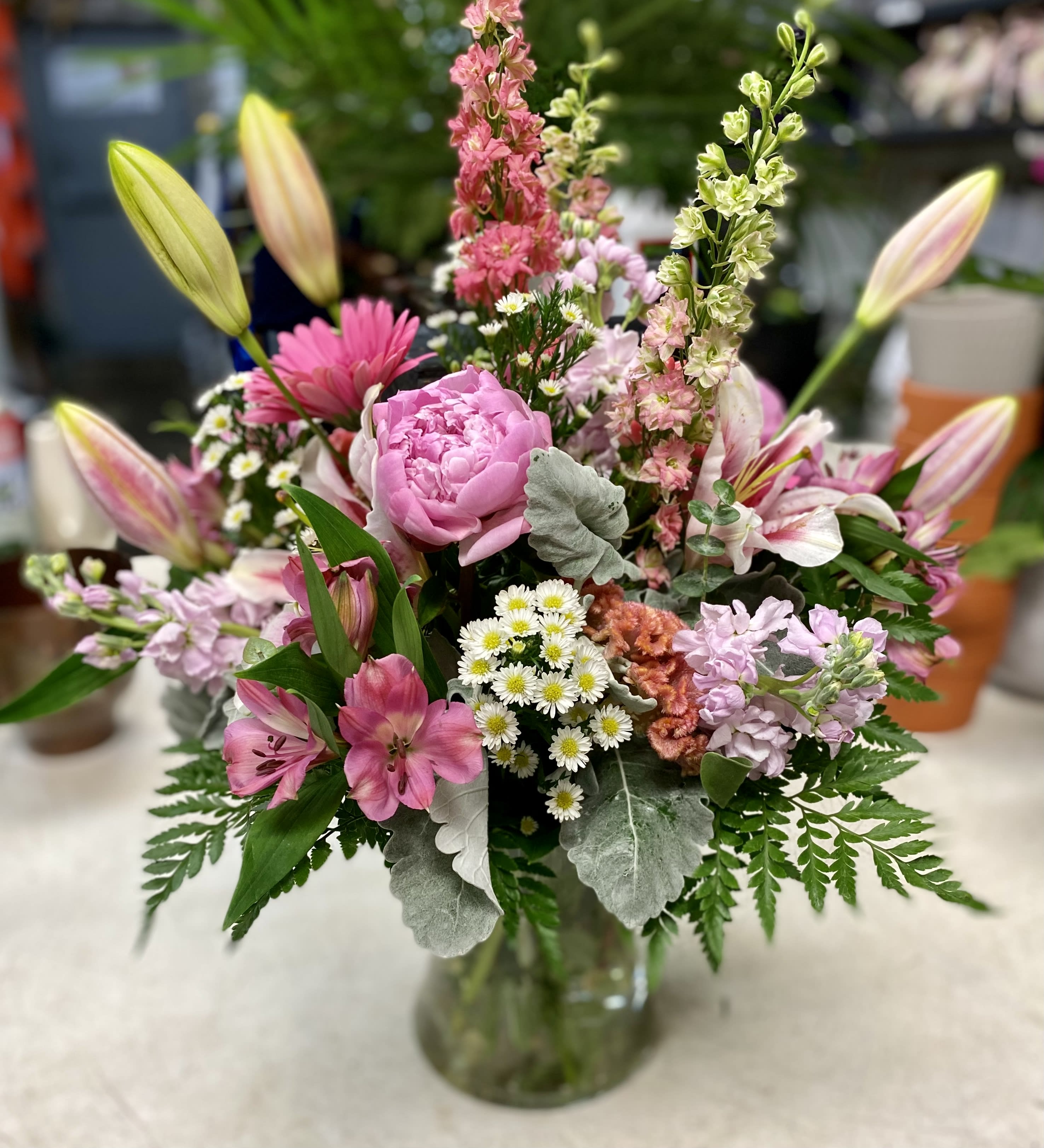 Beauty - A stunning arrangement! Chock full of special blooms ... peonies or garden roses, lilies, gerbers, larkspur and more. Lush and beautiful! Truly special. 