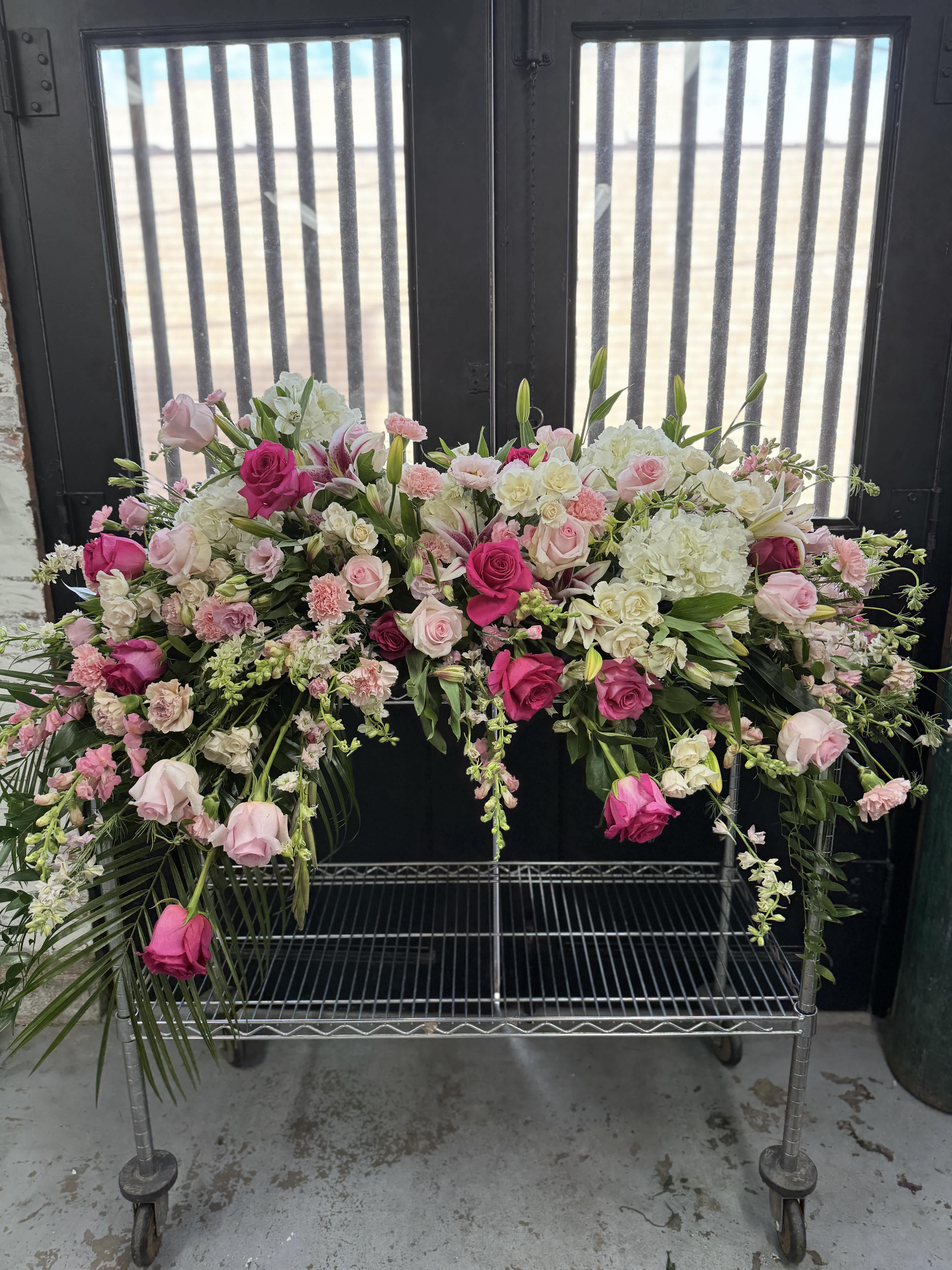 Pinks, Whites, &amp; Everything Nice - This casket cover is uniquely crafted with the love for all things pink and white. Florals may vary depending on product availability.