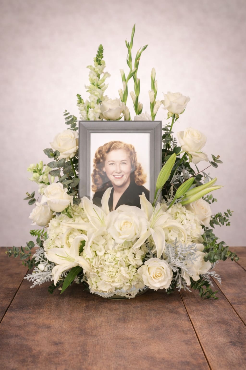 Eternal Peace Memorial  - Funeral flowers, a symbol of sympathy and condolence, arranged elegantly to honor the memory of a loved one.   A unique arrangement hand created by our experienced designers. Please note that every design is custom made and substitution to container and flower types may happen from time to time. Design aspects will always stay the same, but if needed, we will substitute with flowers of equal or greater value to offer you a great floral shopping experience! Our flowers are 100% guaranteed. Please call us with any questions or concerns.