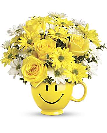 Smiley Face Mug - Bring instant smiles with this bright and happy arrangement, designed in a sunny yellow smiley mug that adds charm long after the flowers are enjoyed. A fun and uplifting gift that delivers happiness at first sight. 