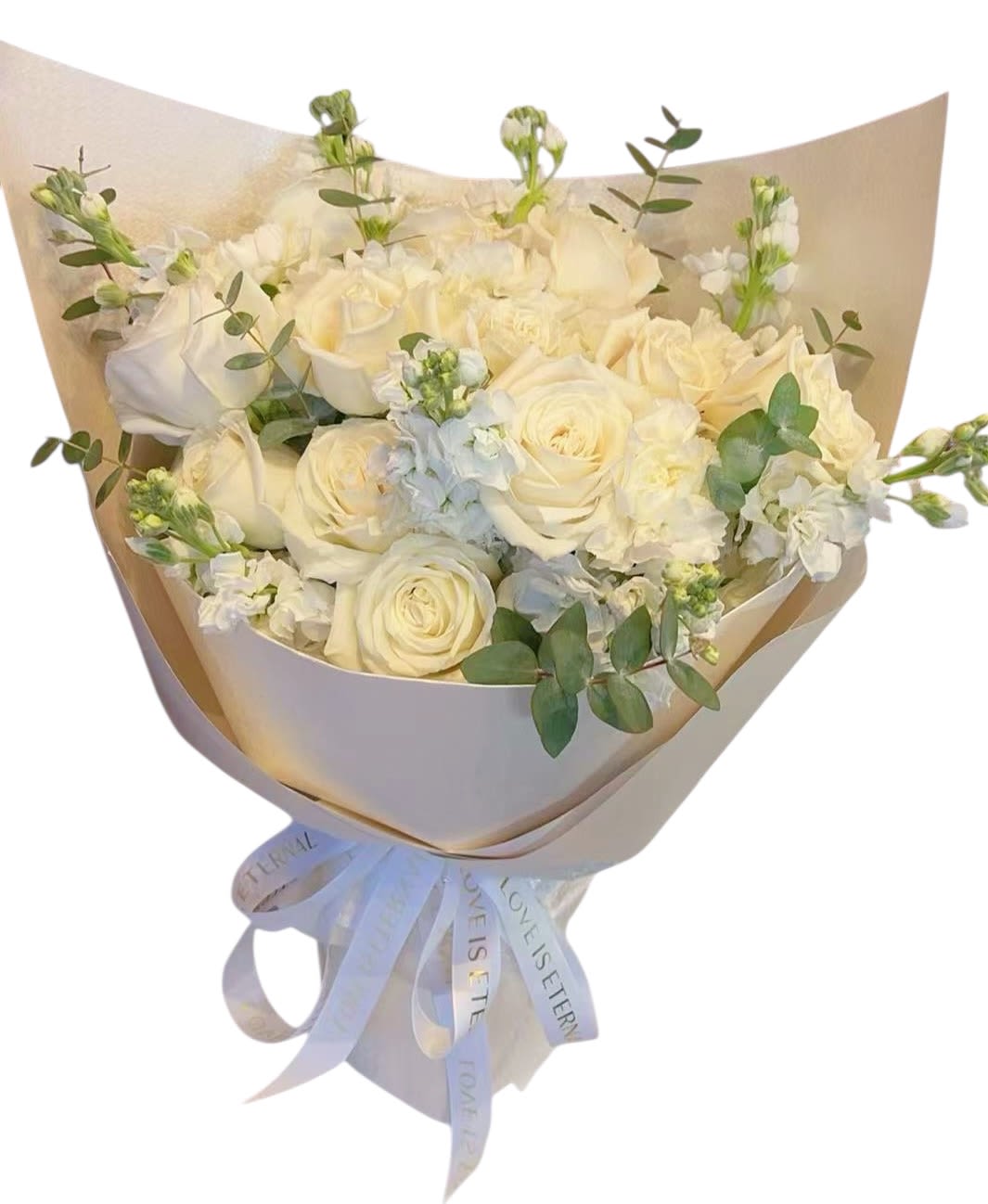 Eternal Grace – White Rose Bouquet - Eternal Grace is a timeless bouquet featuring premium white roses beautifully paired with delicate stock flowers and fresh eucalyptus.  Wrapped in elegant champagne-toned paper and finished with a soft satin ribbon, this arrangement expresses pure love, grace, and sincerity.  Perfect for anniversaries, sympathy, or simply letting someone know they are deeply cherished.