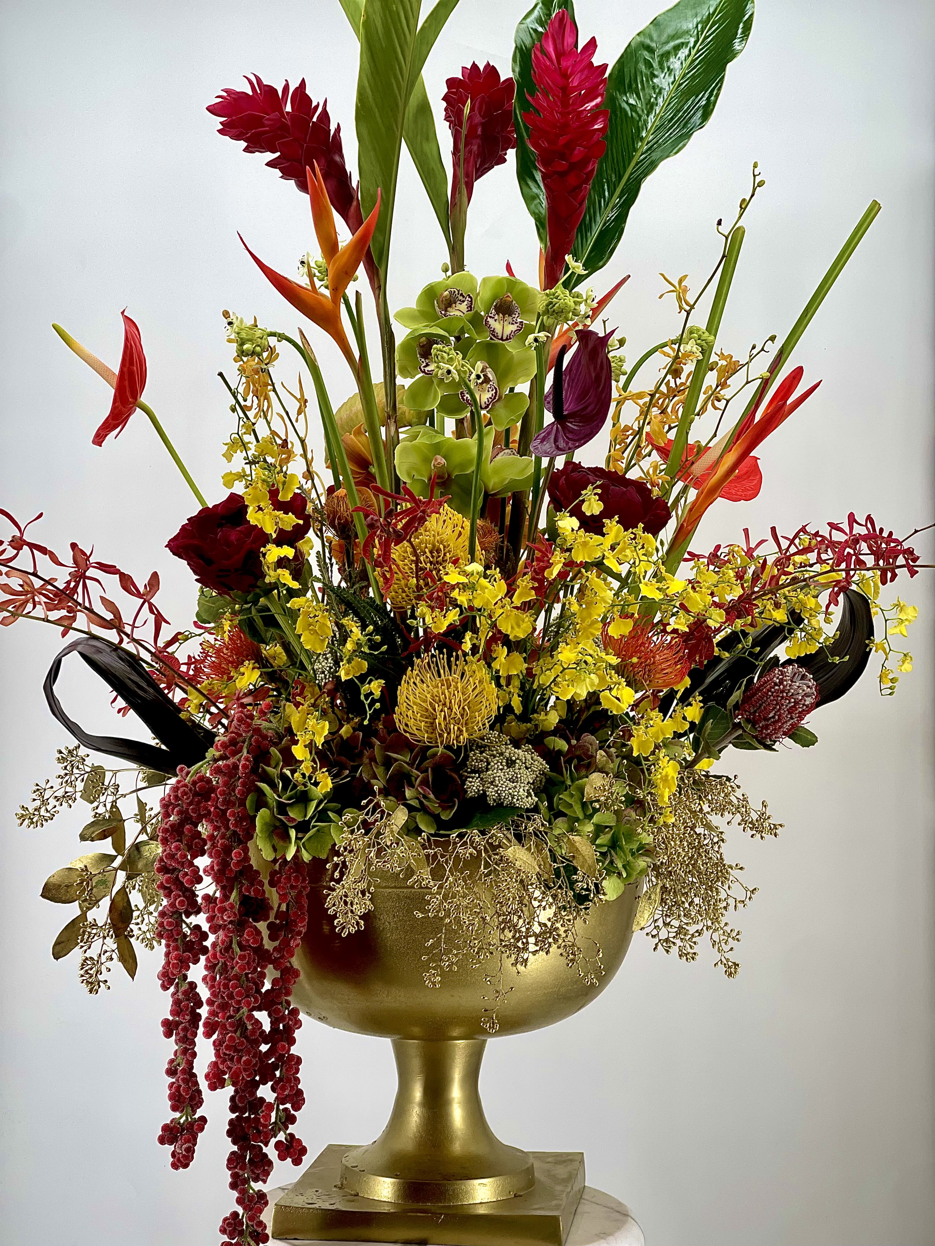 Brass Imperial Bloom - A luxury floral arrangement designed to impress for any occasion or events .Artfully composed with exquisite blooms and presented in a beautiful ,high -end brass vase , this piece brings timeless elegance and refined warmth to any space .Perfect for high -end hotels, events ,and refined interior. 