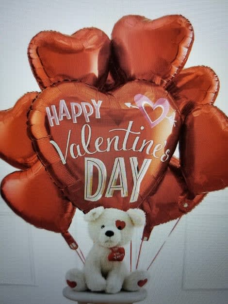 I Love you Balloons and Teddy Bear Balloon Bouquet - 7- 18 inch ruby red heart Mylar balloons with 1- 18 inch I Love you Mylar or HVD mylar all tied to a white or brown teddy bear. Can upgrade to add more heart Mylars  
