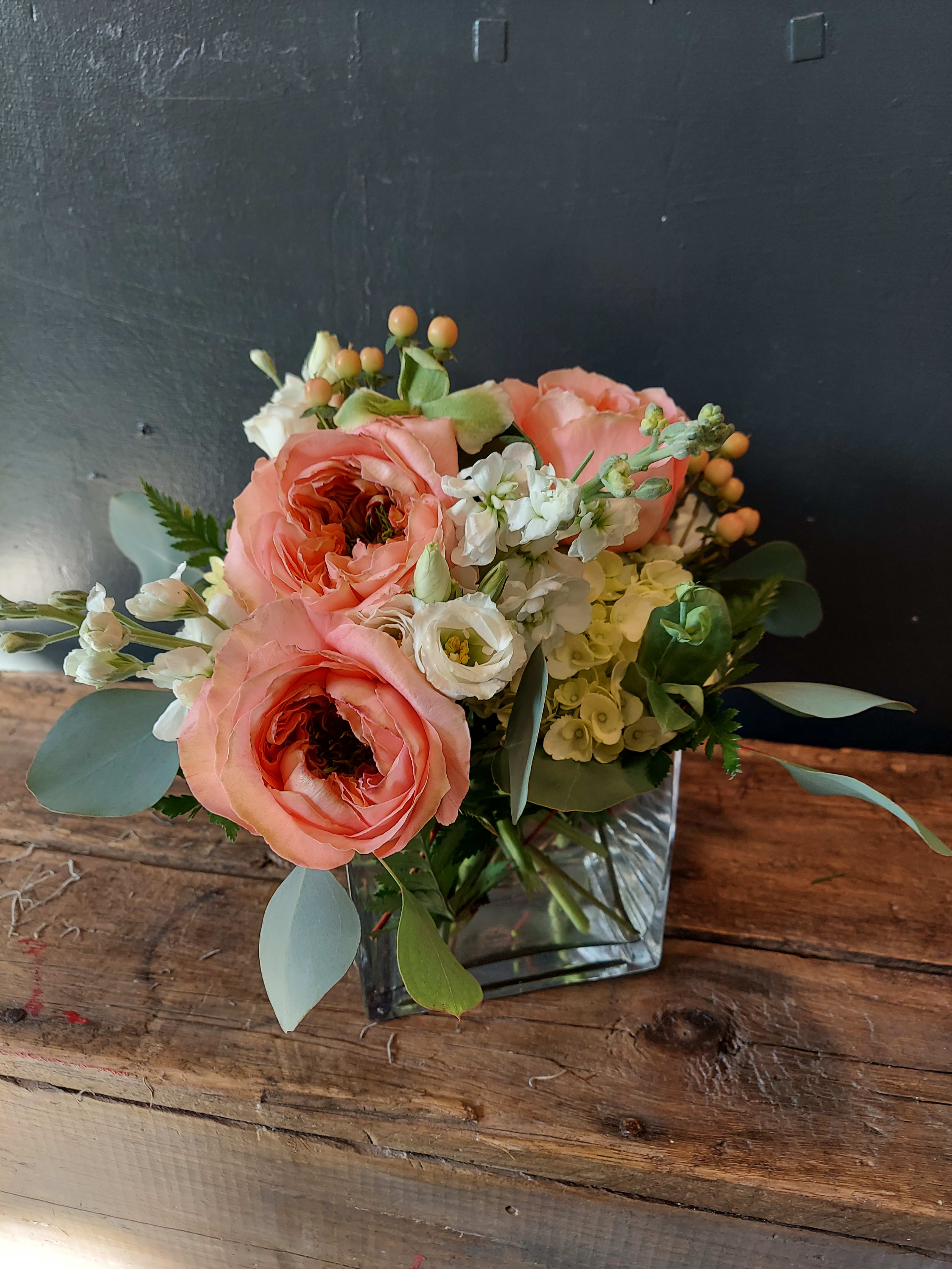 Uniquely Carrie - Carrie at Sunnyside gardens just has the knack for creating this style arrangement featuring her fan favorite, cabbage roses, mixed with whites and celery greens. We also call it her Sunnyside Signature!   Makes the most stunning centerpieces for engagement parties, baby showers, weddings and much more!  Imagine the possibilities with your favorite floral selections? 