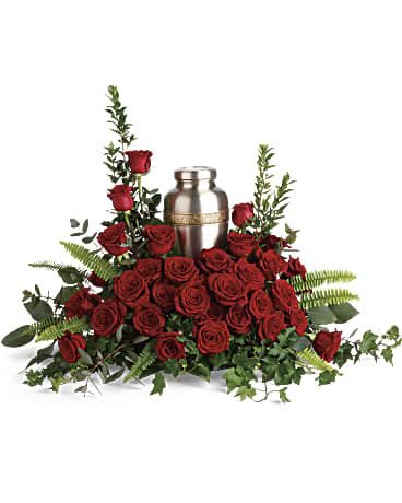  Forever In Our Hearts Cremation Tribute - Elegant red roses and delicate greenery are a breathtaking way to display and honor the cremation urn. Red roses are arranged with myrtle, green ivy, sword fern, silver dollar eucalyptus, and lemon leaf. Arrangement does not include urn. Approximately 32" W x 25" H