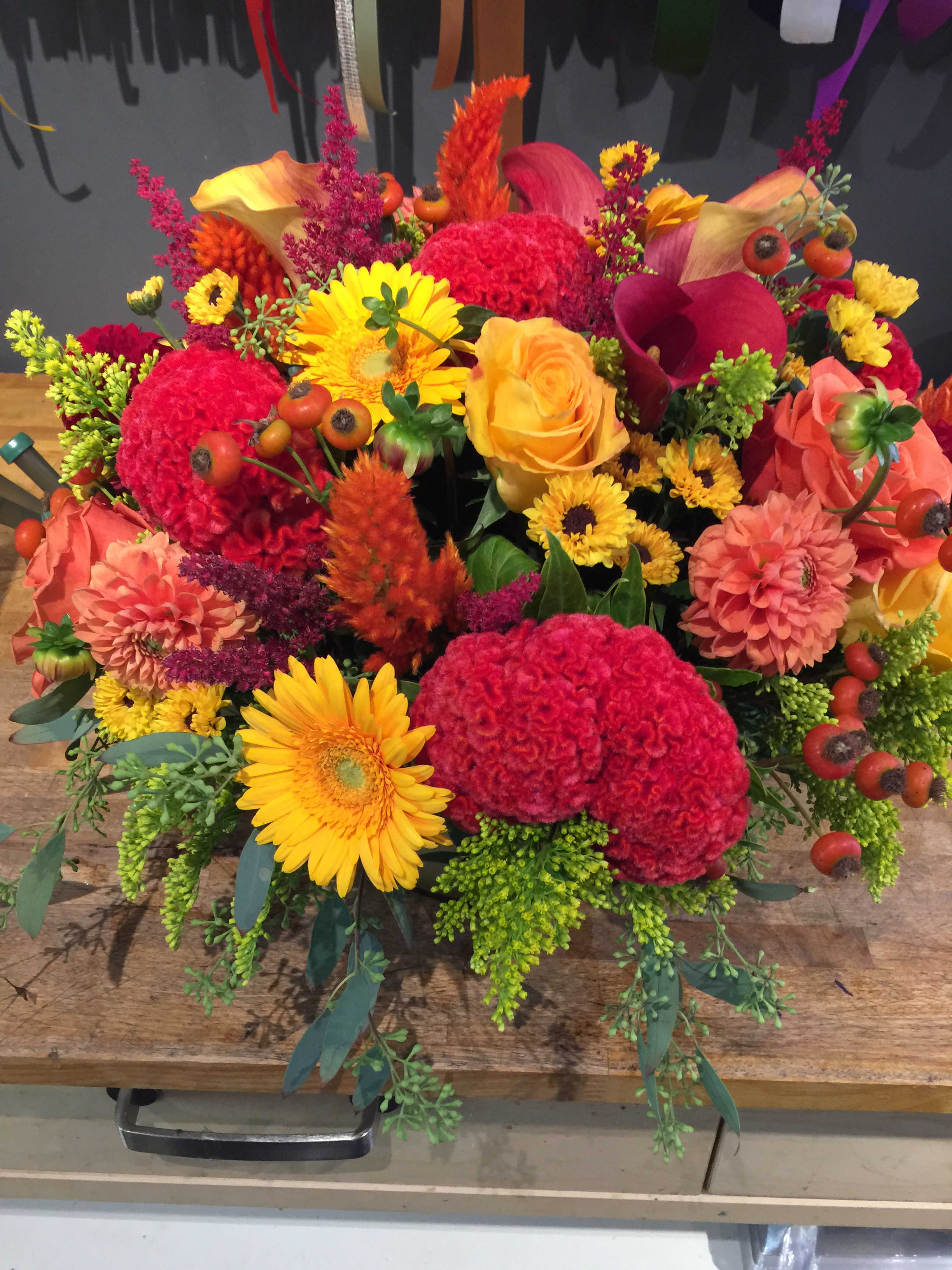 Fall delight - Five arrangements with a mixture of fall seasonal flowers, accented with berries. 2 dinner table size arrangements, 2 coffee table arrangements, 1 powder room arrangement