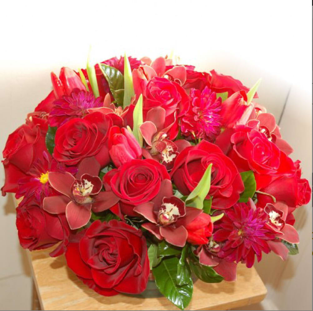 Ruby Red - PLEASE NOTE: SOME FLOWERS, VASES AND OTHER PRODUCTS PICTURED ARE SUBJECT TO AVAILABILITY AND MAY BE SUBSTITUTED FOR A SIMILAR ITEM IF UNAVAILABLE.  Please note: For deliveries outside of our delivery area, English Rose Garden works directly with our preferred florist network . We will ensure that your arrangement is designed with the freshest stems available and delivered in a timely manner. We cannot guarantee the availability of exact flowers and containers.