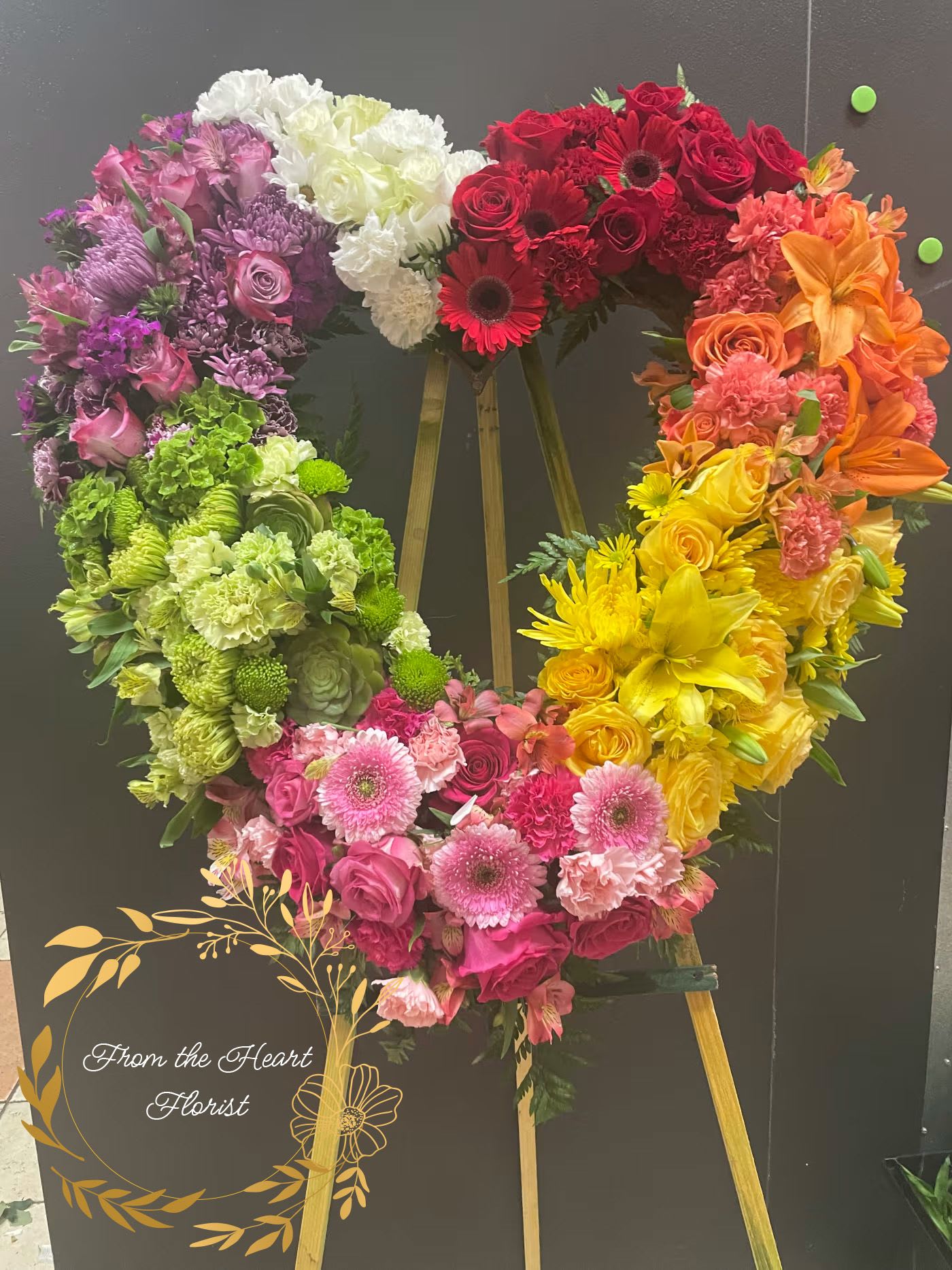 Rainbow Heart  (FH18) - This colorful standing rainbow Heart made with roses, lilies, carnations, gerbera daisy, mums,  
