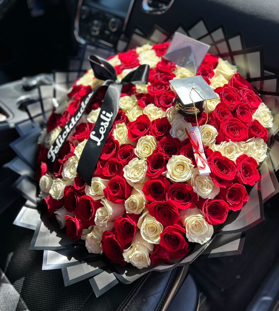 125 Roses Ramo Buchon w/black paper  - Beautiful 125 rose Ramo Buchon, mix of white and red roses. Ribbon will say Happy Valentines Day 