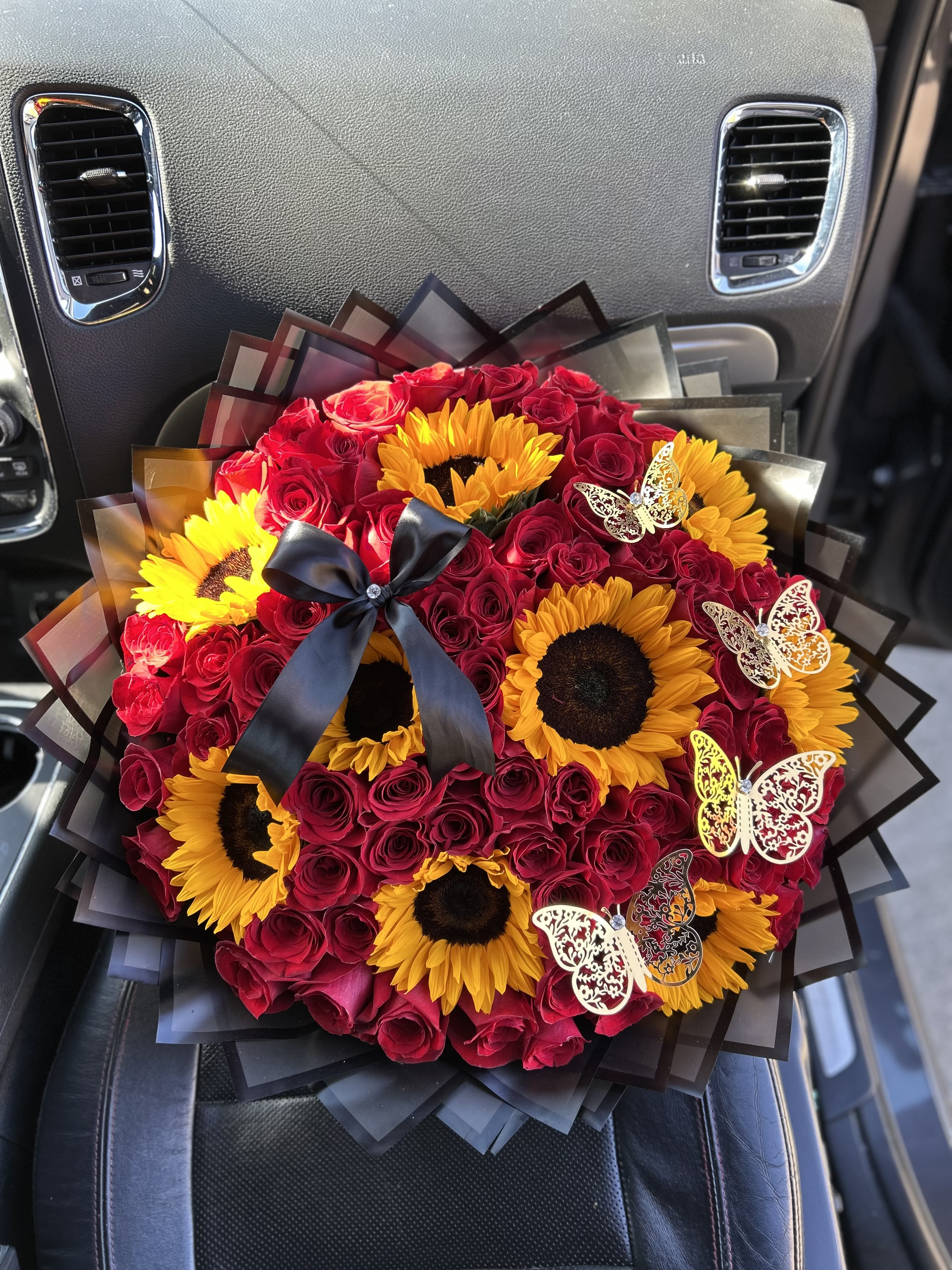 75 Red Roses and Sunflowers  - Complete with black paper and gold butterflies. 