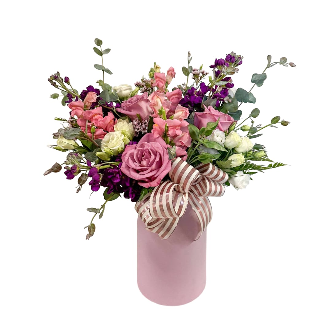 Debbie  - The Debbie is a beautiful arrangement with roses, stock,  snapdragons, and lisianthus. (Vase style and color may vary)