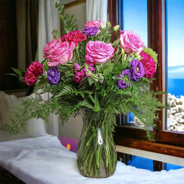 Charm and Comfort Bouquet - Designed by florists, this bouquet evokes comfort and charm through its bright shades. Roses and snapdragons add gorgeous texture to complement the blooms in this arrangement.  Please Note: The One Roses florists put love into every arrangement. Sometimes they have to substitute flower types, colors &amp; containers to give you the freshest blooms available. Although your bouquet may vary from the photo shown, we anticipate your recipient will love it just as much!  Vase may be different from the image.