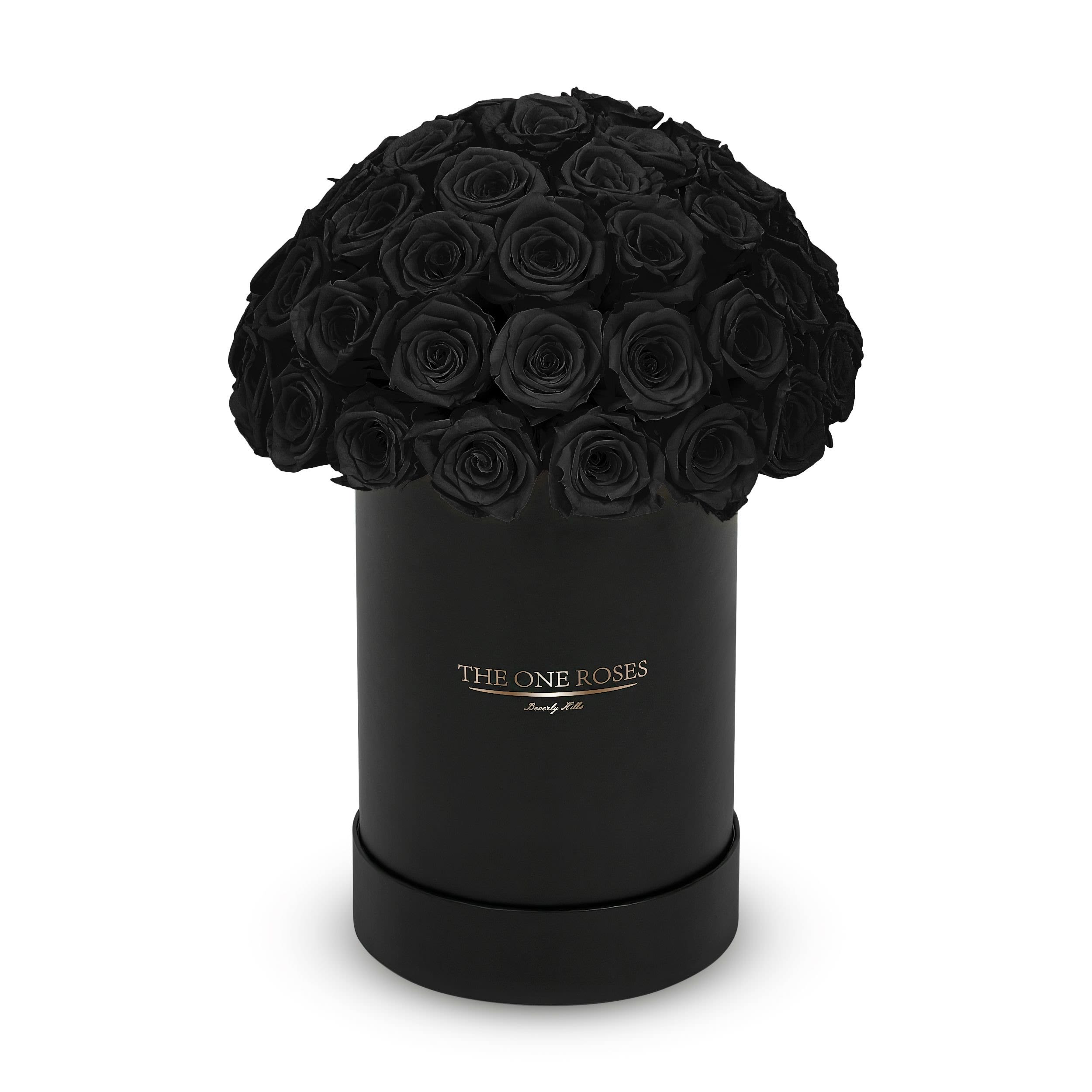 Round Dome | Basic Black Box Onyx Black - The “Runway Round Collection”. consists of unique, real preserved roses in basic round handcrafted luxury soft touch box with a top. About 40-50 stems of The One long lasting (med size) preserved roses.    Durability: approx. 1-3 years.  Our roses, which are carefully sourced from the highest quality gardens in Ecuador, are made to represent the eternal yet ephemeral nature of Love itself. Our Roses are specially customized with essential oils to increase the fragrance.  Product Care: DO NOT Water the roses! AVOID direct exposure to sunlight. Keep the arrangement in a room-temperature environment. If dust collects after a few months, remove it lightly using a duster. DO NOT place anything onto the roses as they can crush and damage the roses. DO NOT remove the roses from the box; they are secure and happy there. DO NOT allow roses to have direct contact with light colored fabric or surfaces, as staining may occur. The lid is meant to stay on the side or bottom of the box. Be mindful when carrying the arrangement: it's a very delicate product!