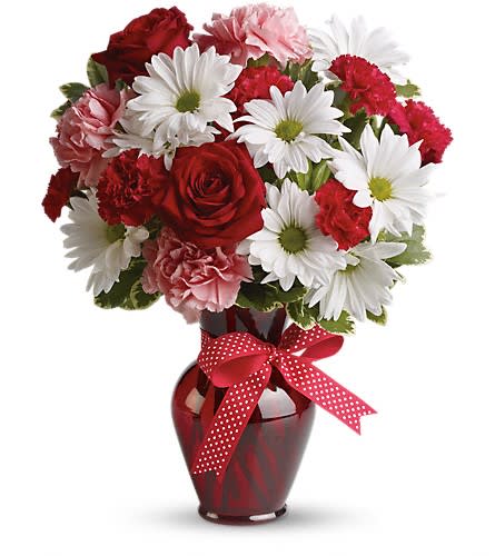 Hugs and Kisses Bouquet with Red Roses - Delight your love with this beautiful bouquet of bright white chrysanthemums precious pink carnations romantic red roses and more in a radiant red vase. The charming bouquet includes white daisy spray chrysanthemums pink carnations red miniature carnations and red roses accented with fresh greenery in a stylish red vase.Approximately 12 1/2" W x 15" H Orientation: One-Sided As Shown : T11Z100ADeluxe : T11Z100BPremium : T11Z100C