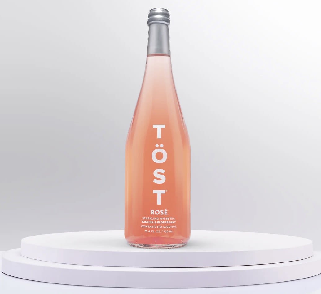 TÖST Rosé - Non alcoholic  - TÖST ROSÉ bottles are all-natural, delicious, dry, sparkling, alcohol-free beverages with white tea, Ginger and Elderberry. TÖST creates Meaningful and refreshing drinking experiences that are perfect for every occasion.