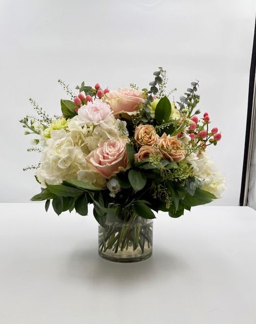 Blush and Berry Garden  - Part of our brand new and fresh Valentine collection, this arrangement  has hydrangea, and , Mondial roses, stock, carnations, berries and more.  Perfect alternative to the traditional "Red" on Valentines Day