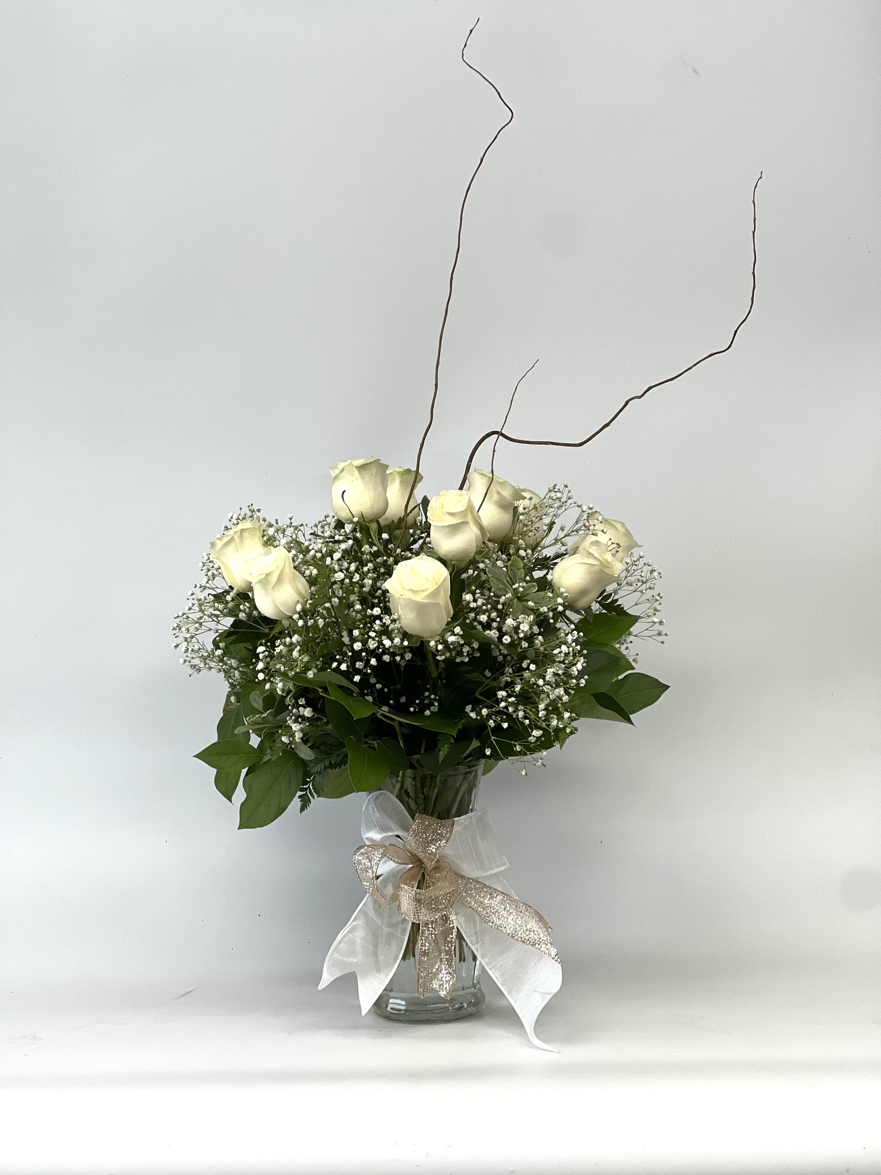 Dozen Long Stemmed White Roses by BloomNation™ - A dozen white roses are a classic gift! Perfect for Valentine's Day, an Anniversary, or any type of celebration.  Approximate Dimensions: 20"D x 30"H