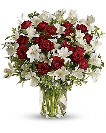 Endless Romance Bouquet - Endless roses, endless romance! Make a statement with our stunning bouquet of red roses with snowy white blossoms, delivered in a glass hurricane vase that will forever remind her of your love. Includes red spray roses, white alstroemeria and pretty pitta negra. Delivered in a glass hurricane vase. 