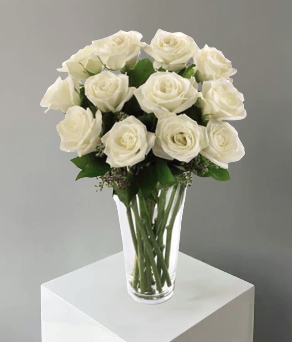  White Rose Bouquet (FTD) - The beauty of white roses is unchallenged. Representing innocence their versatility makes them a favorite gift to offer congratulations for graduation engagements bridal showers new baby or even a gift of sympathy.