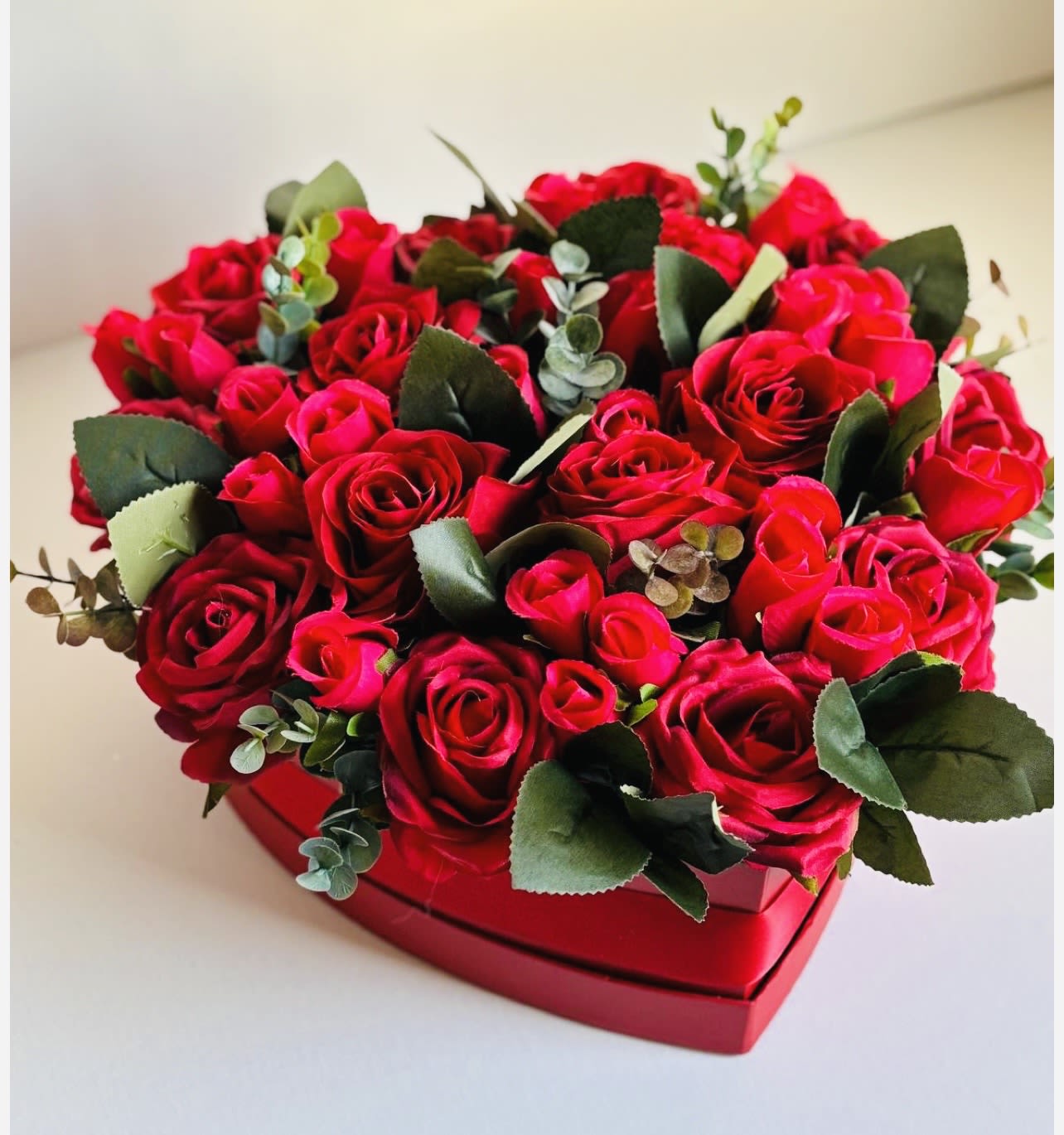 Heart to Heart  - Heart to Heart is a romantic Valentine’s gift that speaks directly from one heart to another. Nestled in a charming heart-shaped box, this arrangement features fresh, vibrant blooms carefully arranged to create a stunning, heartfelt display. Perfect for expressing love, admiration, or deep affection, Heart to Heart is a timeless way to make someone feel truly cherished this Valentine’s Day. 