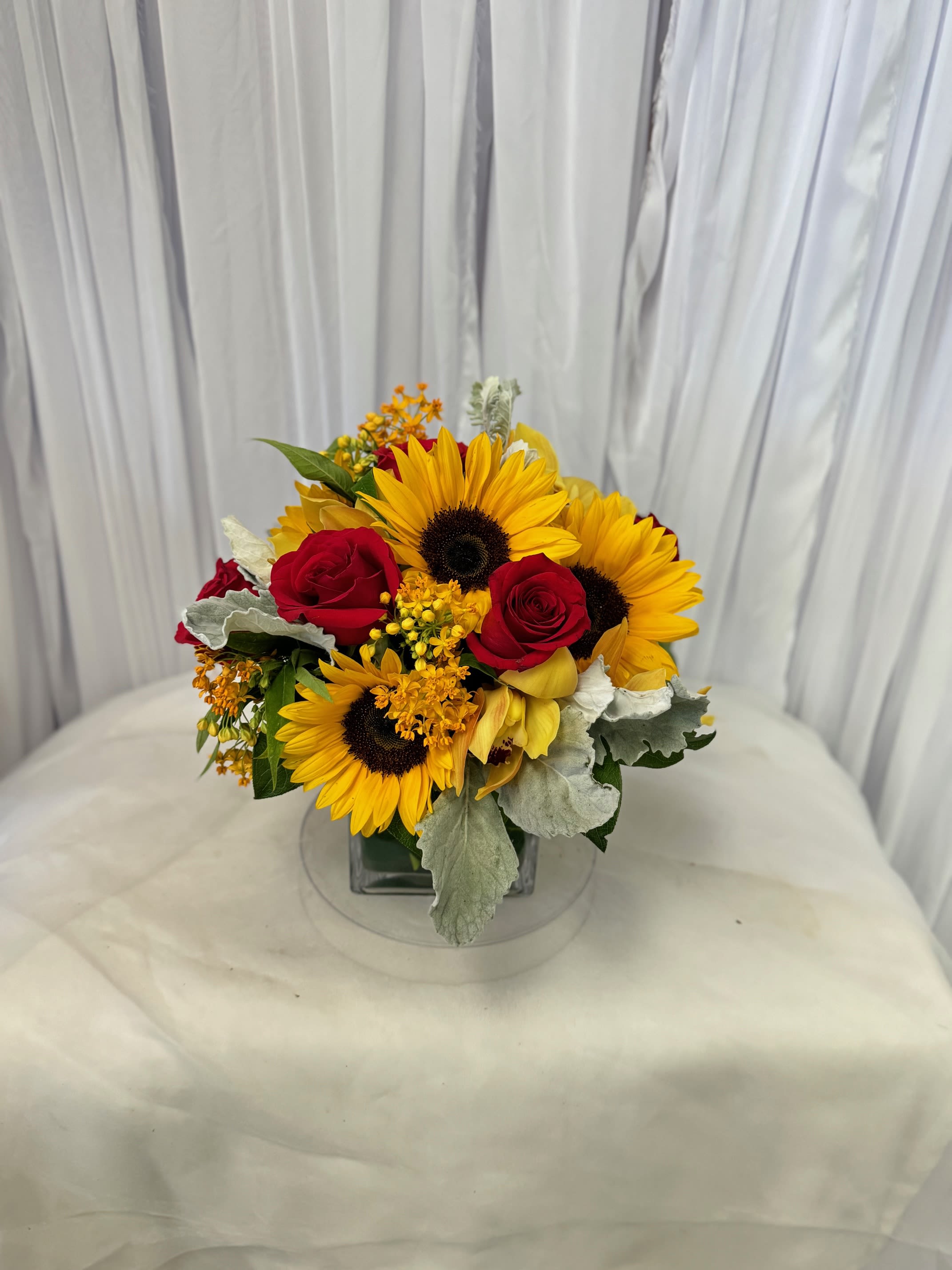 Autmn 9 - Disclaimer IF WE HAVE TO SUBSITUTE:  For flowers, we will make every attempt to match the flower type / color but may substitute with another color or type of flower. For green and blooming plants, similar plants may be substituted of equal or greater value. If the container / vase shown online is not available, a similar container / vase will be used. Bears or other gift items may be substituted as well. Want to check on availability? If it makes you feel more comfortable about the purchase, then we encourage you to call or email us to check on the latest availability of certain products. We would be glad to give you the most current, up-to-date status on our inventory. Deluxe - Additional flowers will be added to enhance the bouquet. Premium - We will add more blooms and select the highest quality flowers we offer in this style.