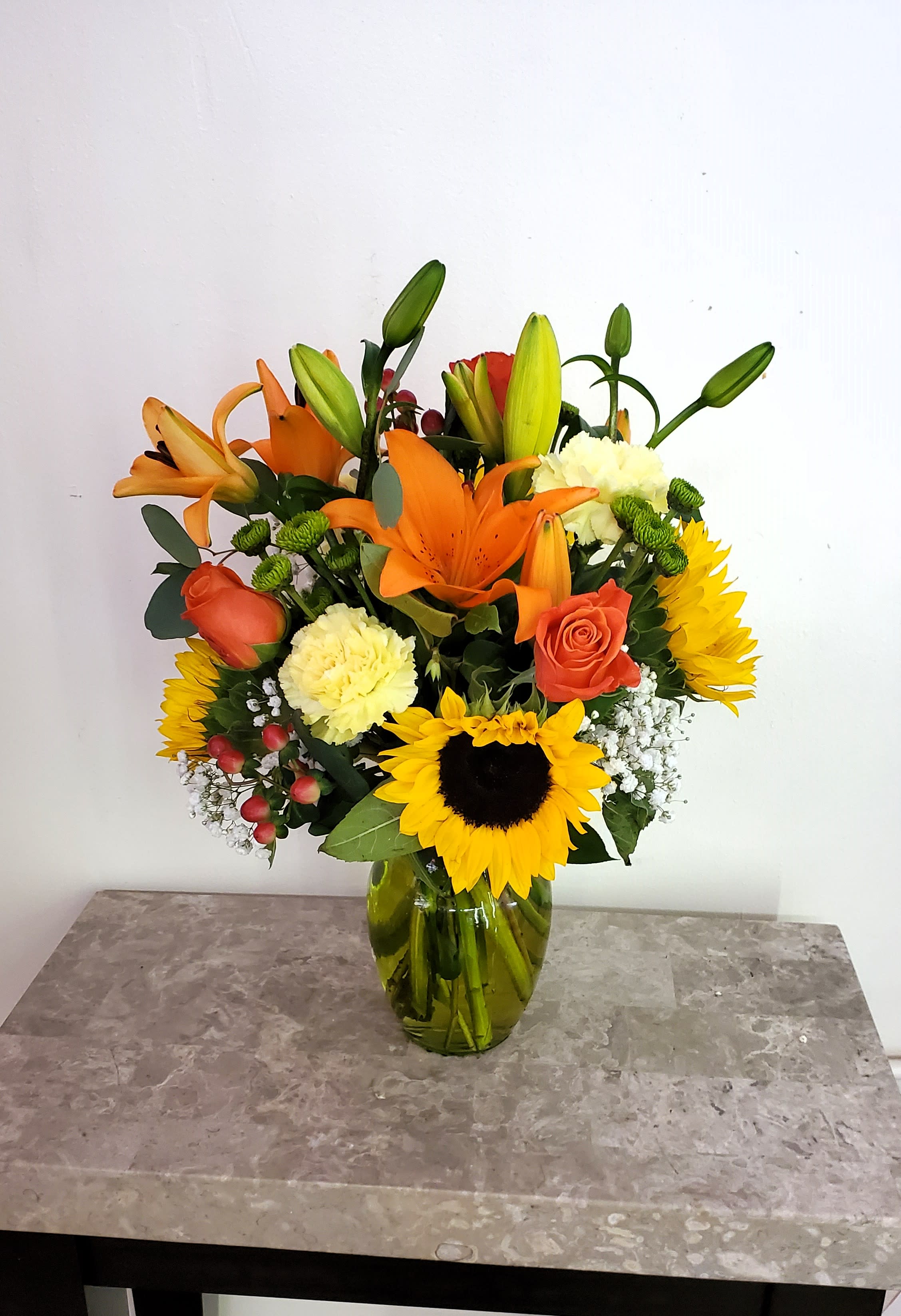 Autumn 3 - Disclaimer IF WE HAVE TO SUBSITUTE:  For flowers, we will make every attempt to match the flower type / color but may substitute with another color or type of flower. For green and blooming plants, similar plants may be substituted of equal or greater value. If the container / vase shown online is not available, a similar container / vase will be used. Bears or other gift items may be substituted as well. Want to check on availability? If it makes you feel more comfortable about the purchase, then we encourage you to call or email us to check on the latest availability of certain products. We would be glad to give you the most current, up-to-date status on our inventory. Deluxe - Additional flowers will be added to enhance the bouquet. Premium - We will add more blooms and select the highest quality flowers we offer in this style.