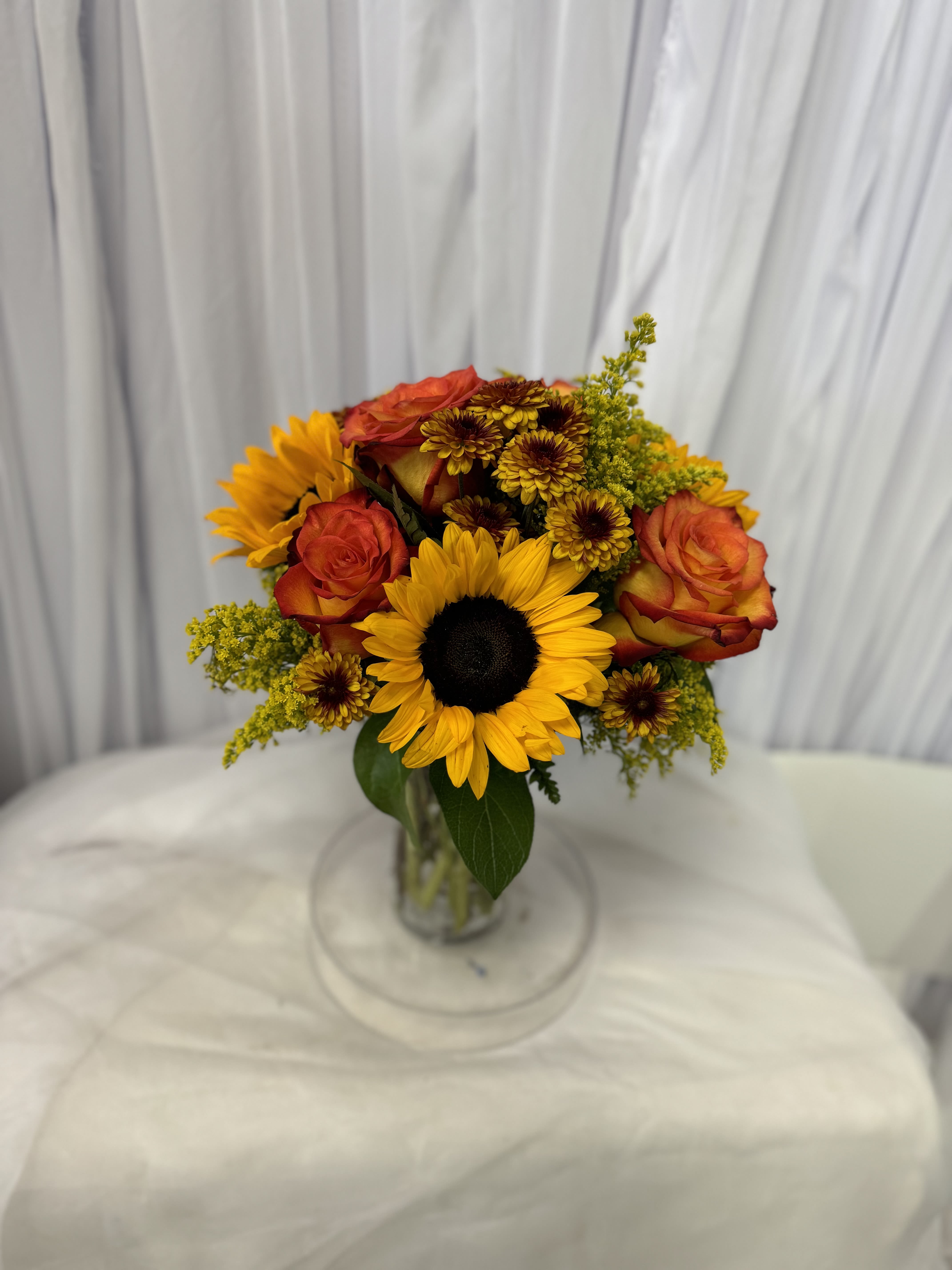 Autumn 5 - Disclaimer IF WE HAVE TO SUBSITUTE:  For flowers, we will make every attempt to match the flower type / color but may substitute with another color or type of flower. For green and blooming plants, similar plants may be substituted of equal or greater value. If the container / vase shown online is not available, a similar container / vase will be used. Bears or other gift items may be substituted as well. Want to check on availability? If it makes you feel more comfortable about the purchase, then we encourage you to call or email us to check on the latest availability of certain products. We would be glad to give you the most current, up-to-date status on our inventory. Deluxe - Additional flowers will be added to enhance the bouquet. Premium - We will add more blooms and select the highest quality flowers we offer in this style.