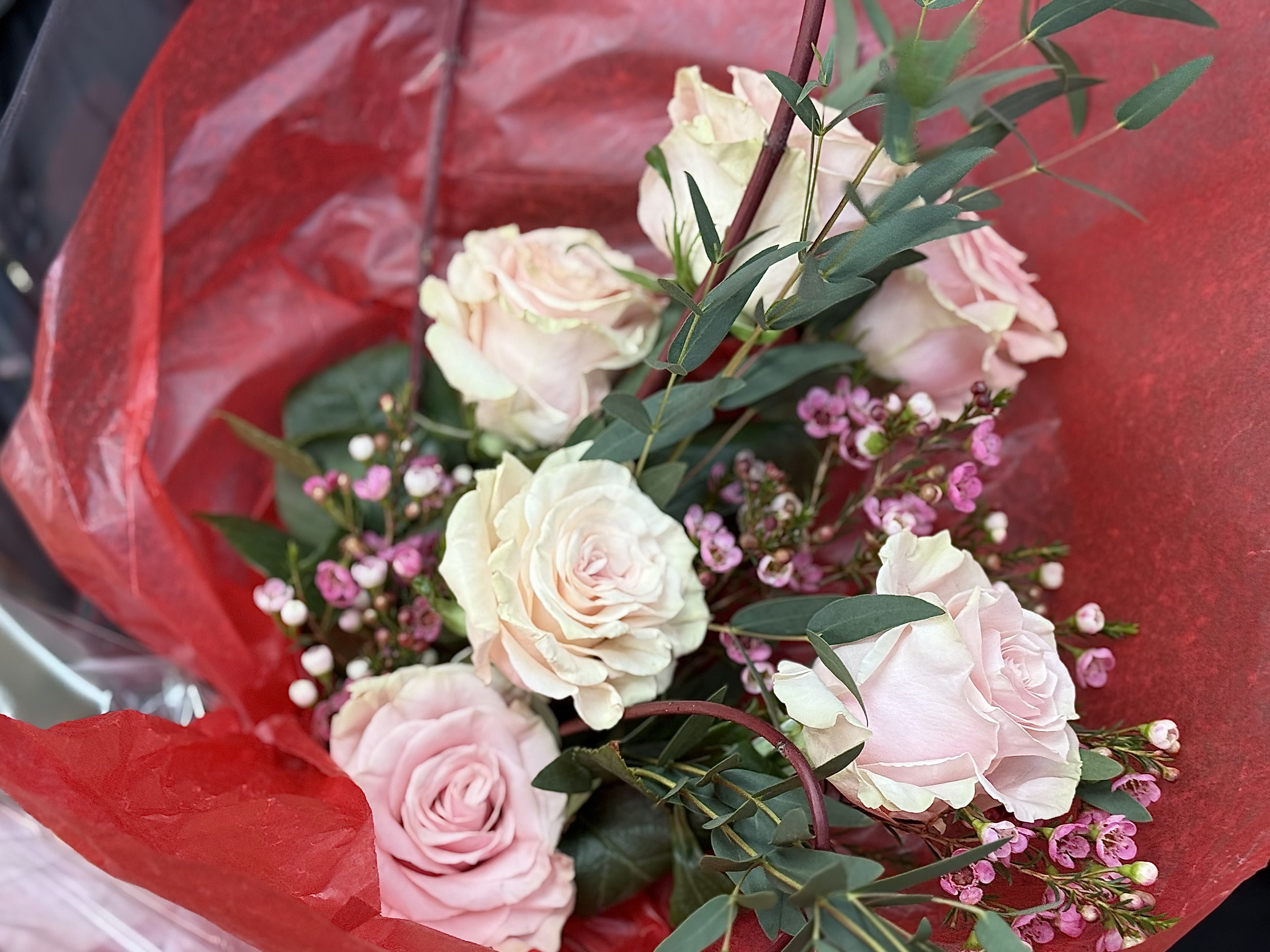 Bouquet of Love - A beautiful bouquet with a half dozen pink roses, filling and a beautifully constructed textural natural heart, can be placed into a vase when delivered.