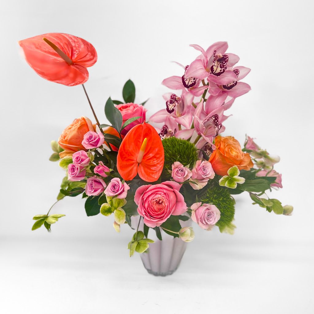 Tropic Like It’s Hot - Turn up the heat with vibrant orchids and bold anthuriums in a sun-soaked, tropical bouquet that’s as fun as it is luxe.