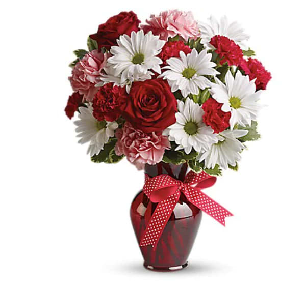 Hugs And Kisses Bouquet With Red Roses - Whether for your significant other or your sister, aunt or grandmother, this delightful floral gift is a sweet way to say "I love you." Sweet price, too. The charming bouquet includes white daisy spray chrysanthemums, pink carnations, red miniature carnations and red roses accented with fresh greenery in a stylish red vase.   Orientation : All-Around  All prices in USD ($)  Standard  T11Z100A  Deluxe  T11Z100B  Premium  T11Z100C